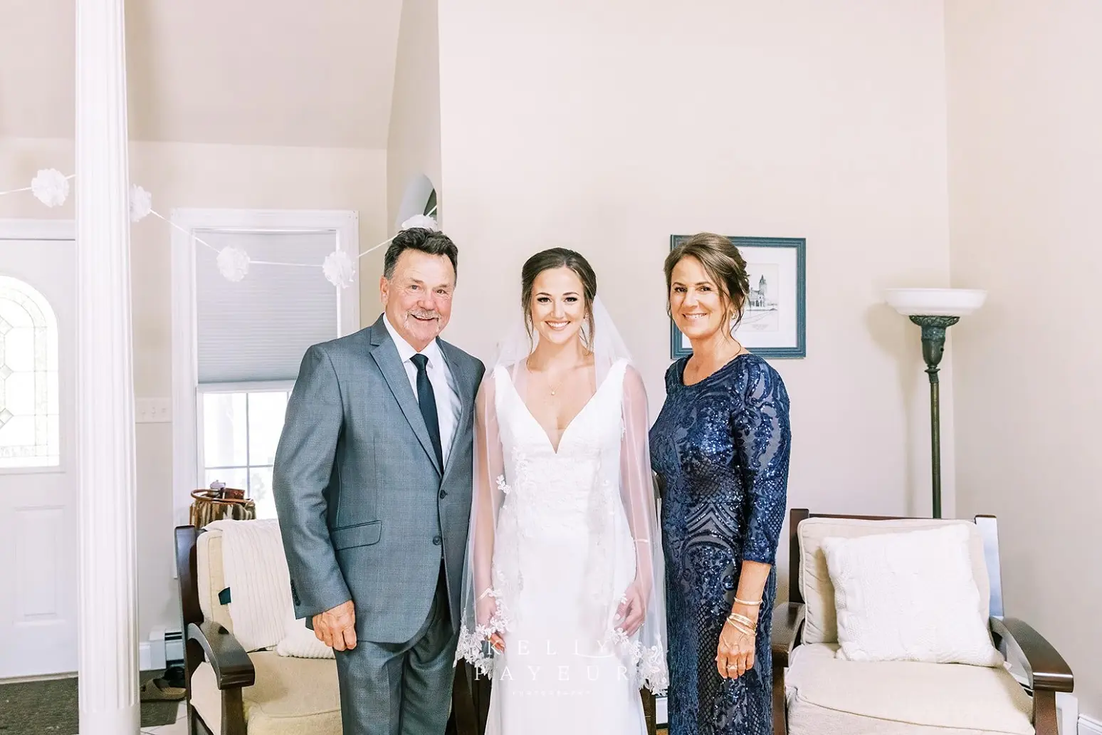 Bride wearing simple crepe wedding dress Bertina by Maggie Sottero.