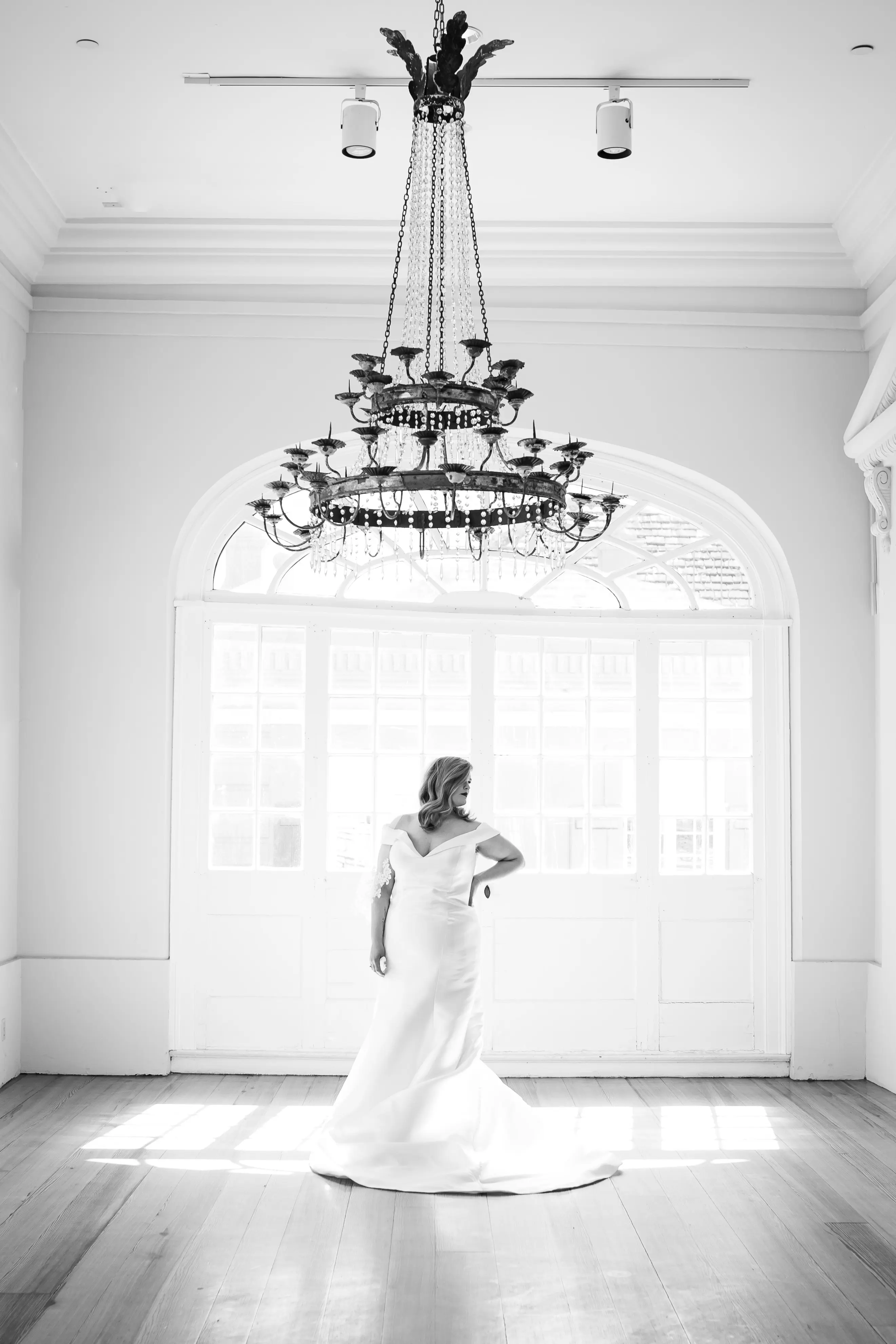 Bride Wearing Vintage Glamour Timeless Off-The-Shoulder Fit-And-Flare Wedding Dress Called Josie By Rebecca Ingram