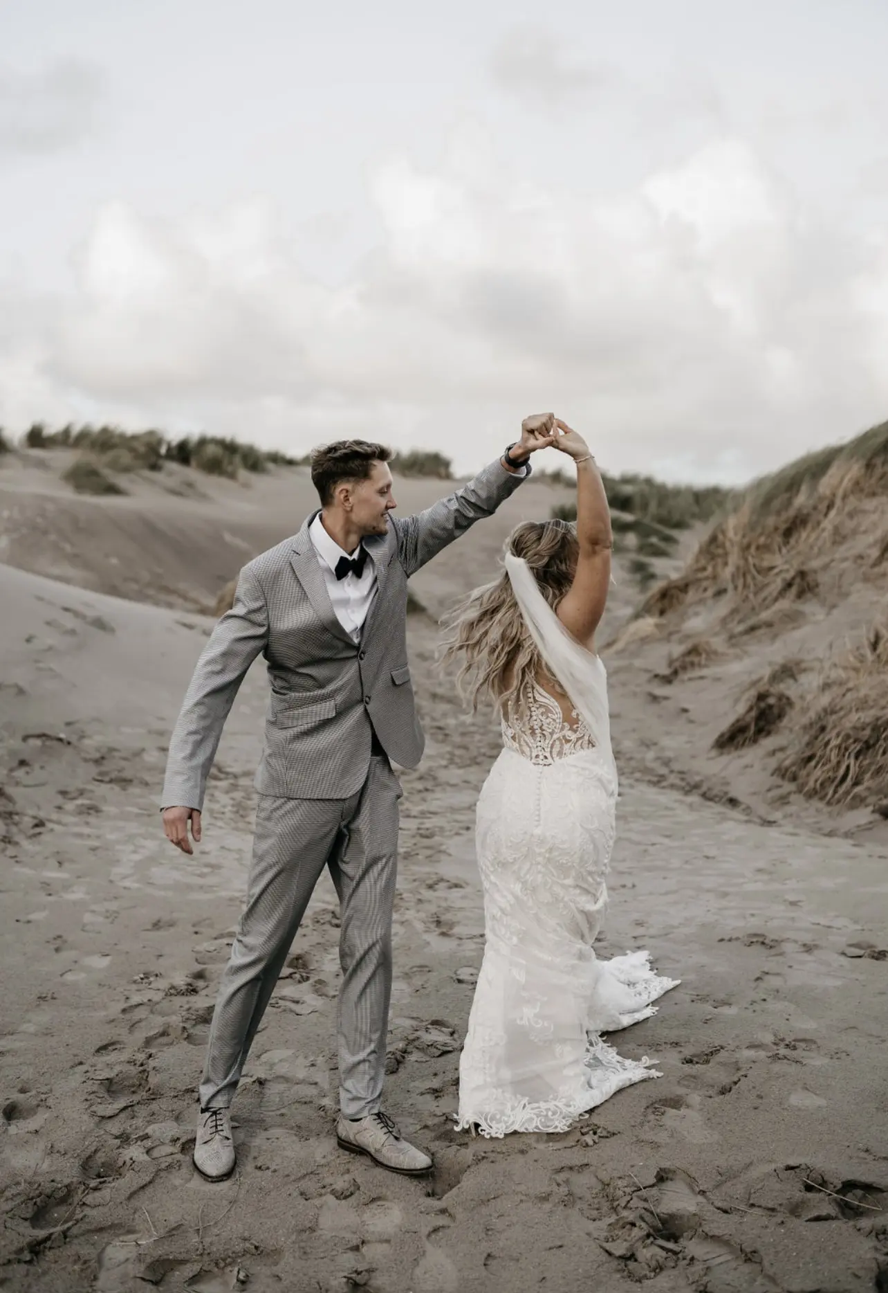 Bride Wearing Illusion Lace Back Wedding Dress Called Hamilton By Sottero And Midgley Spinning With Groom
