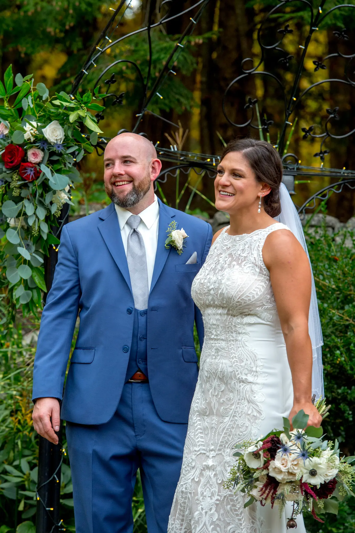 Bride wearing Lace Sheath Wedding Dress called Kevyn by Sottero and Midgley with groom