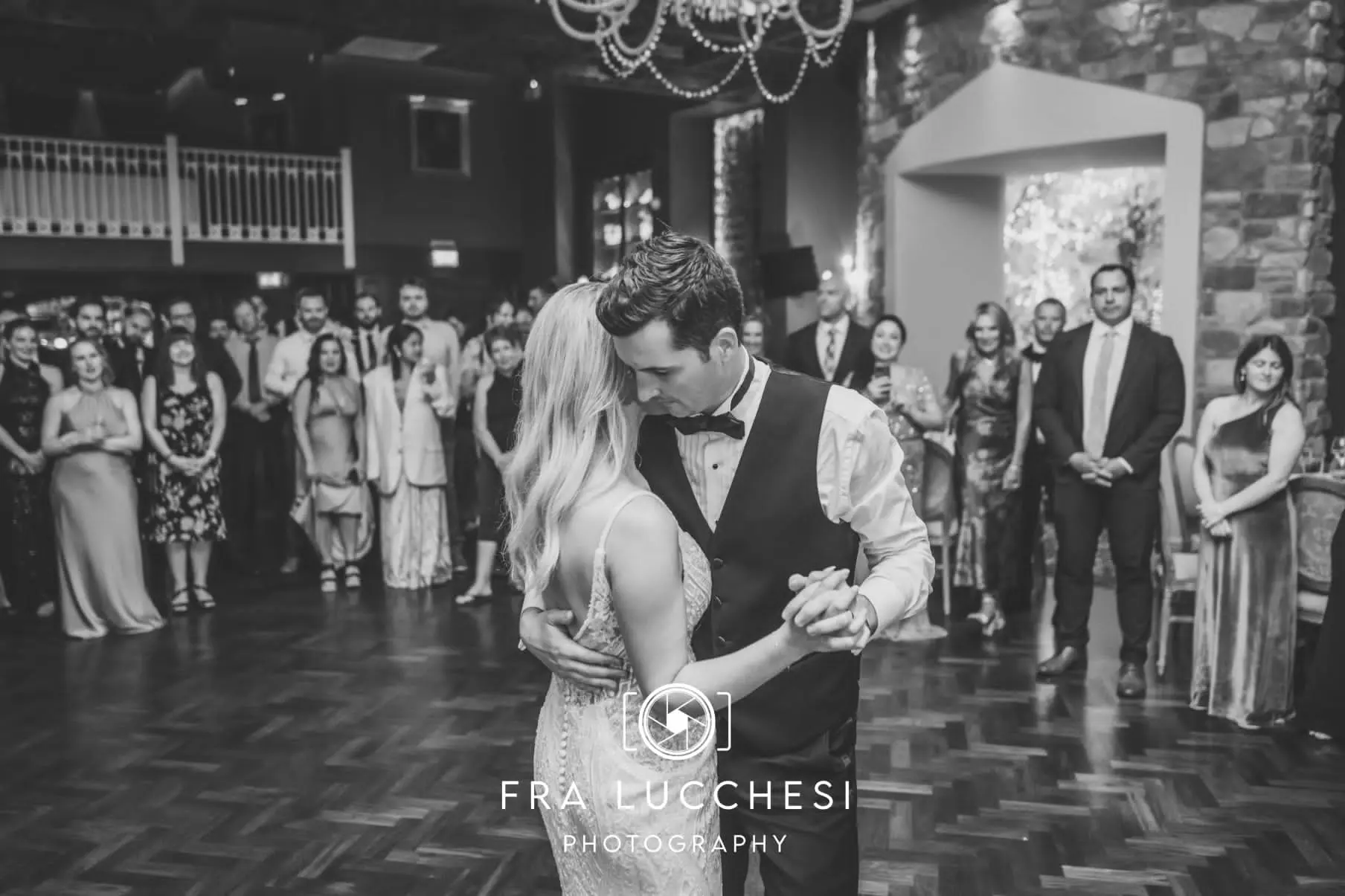 Bride wearing Bailey wedding dress by Sottero and Midgley dancing with her husband