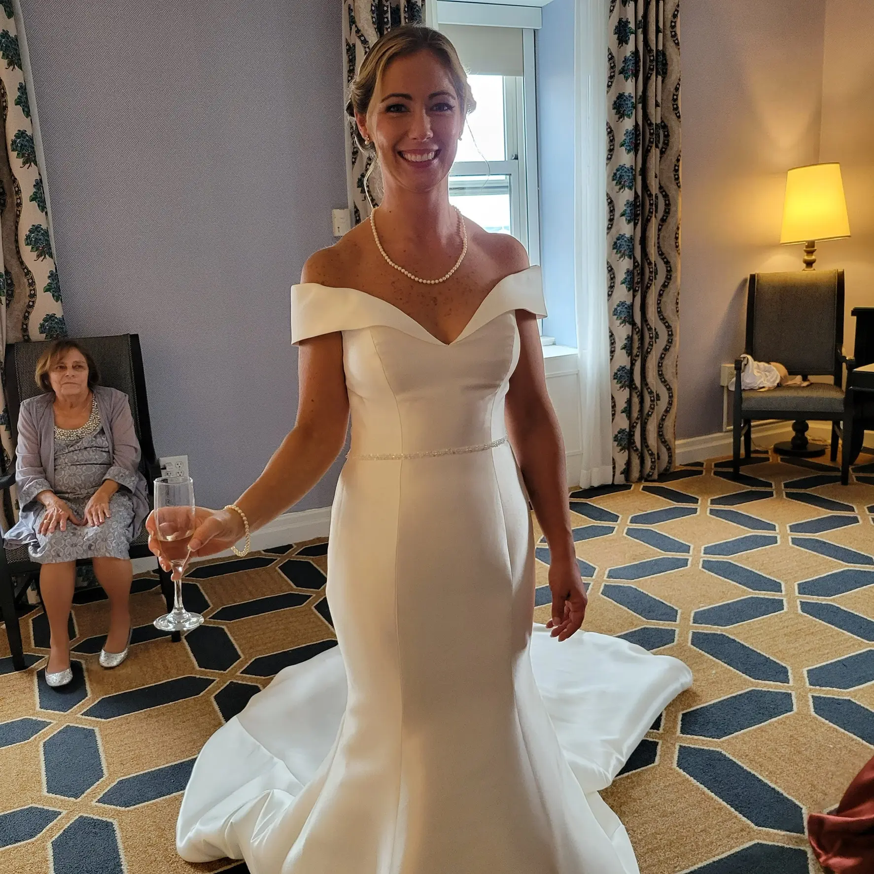 Bride Wearing Simple Fit And Flare Wedding Dress Called Josie By Rebecca Ingram