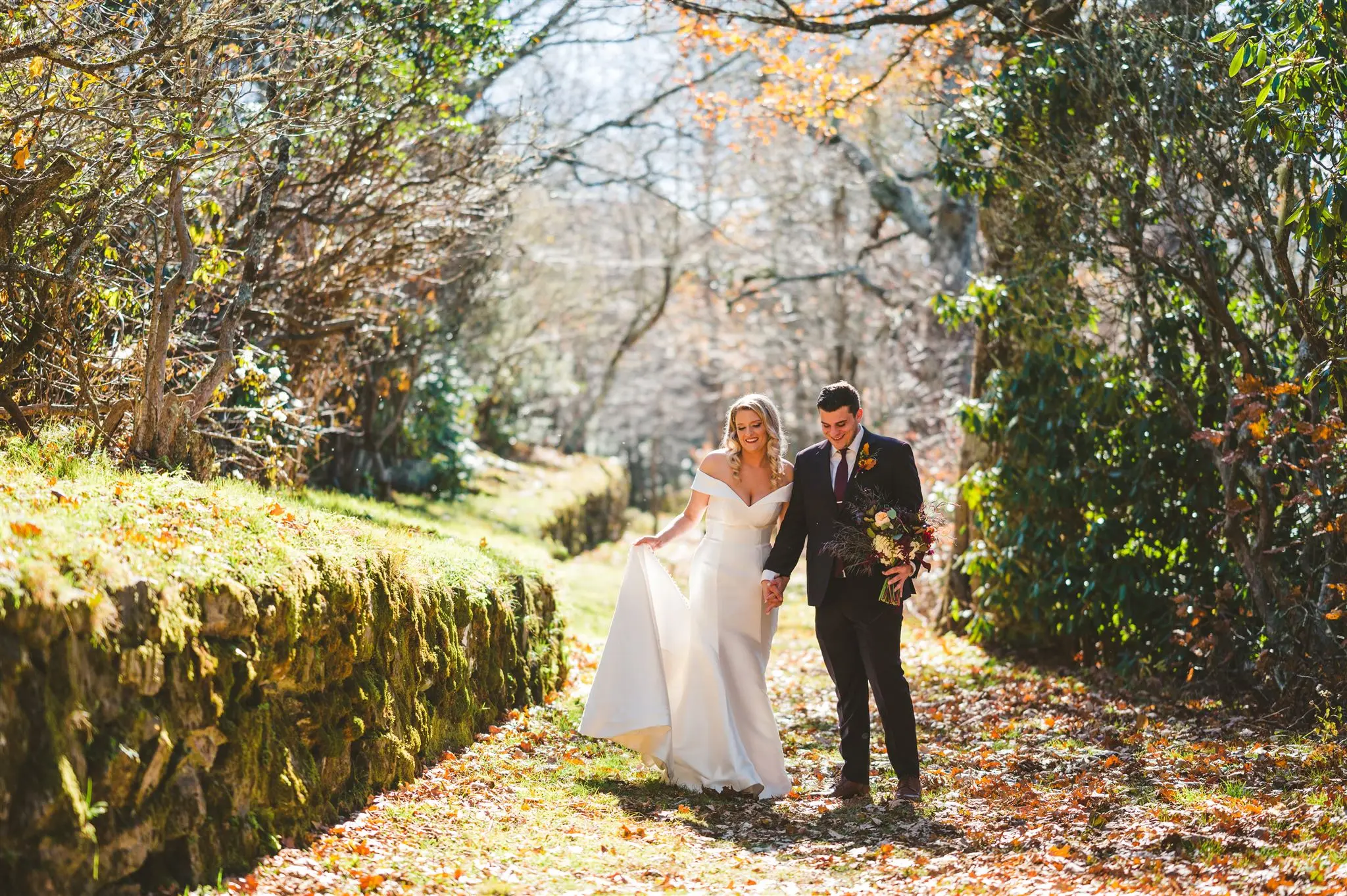 Groom With Bride Wearing Vintage Glamour Off-The-Shoulder Wedding Dress Josie By Rebecca Ingram