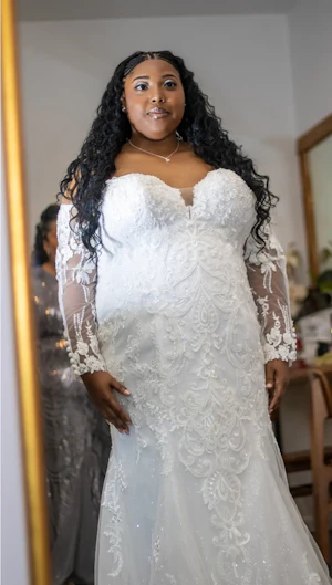 Bride wearing Frederique Royale by Maggie Sottero looking in the mirror