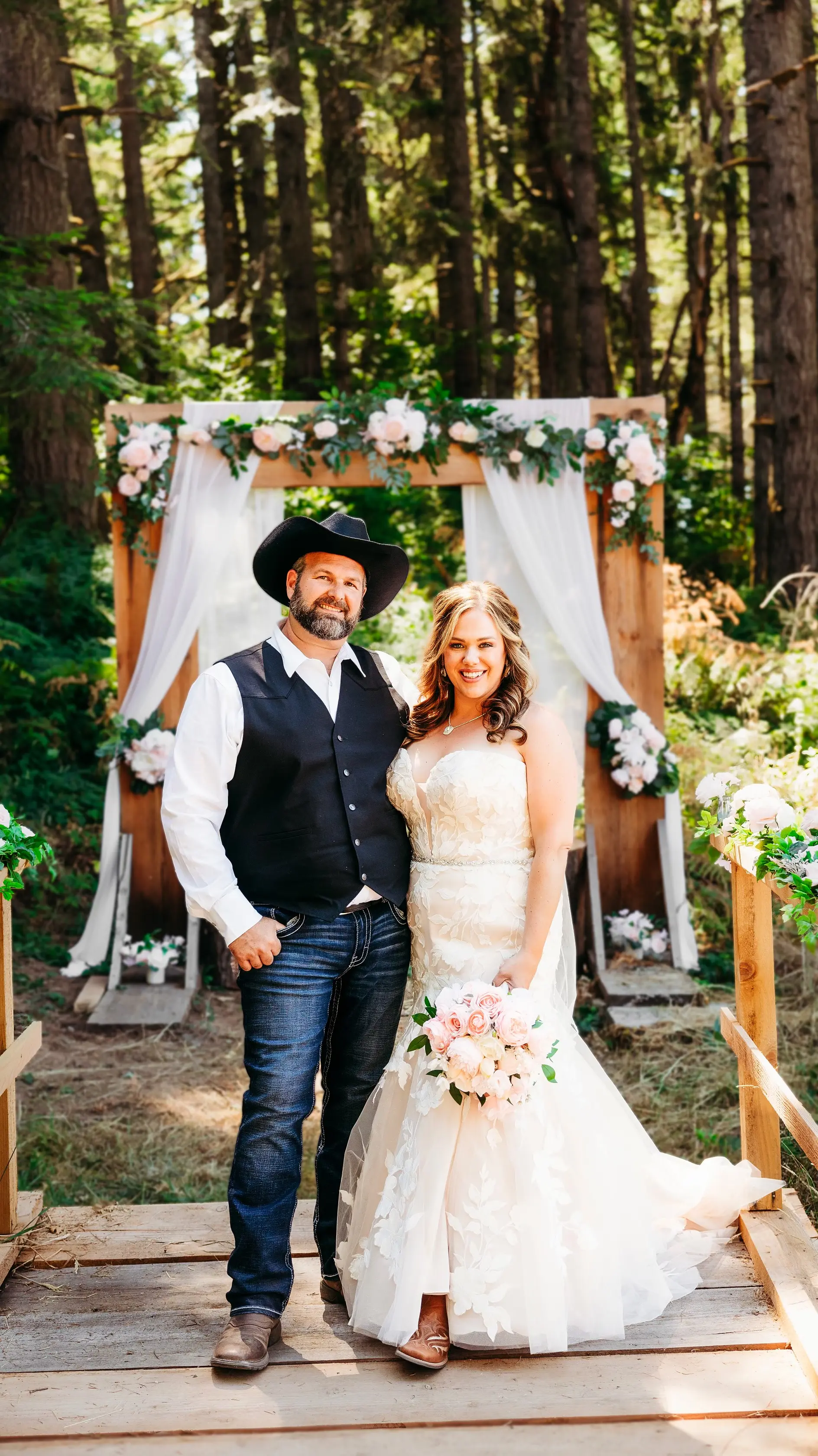 Bride wearing Hattie wedding dress by Rebecca Ingram with her husband