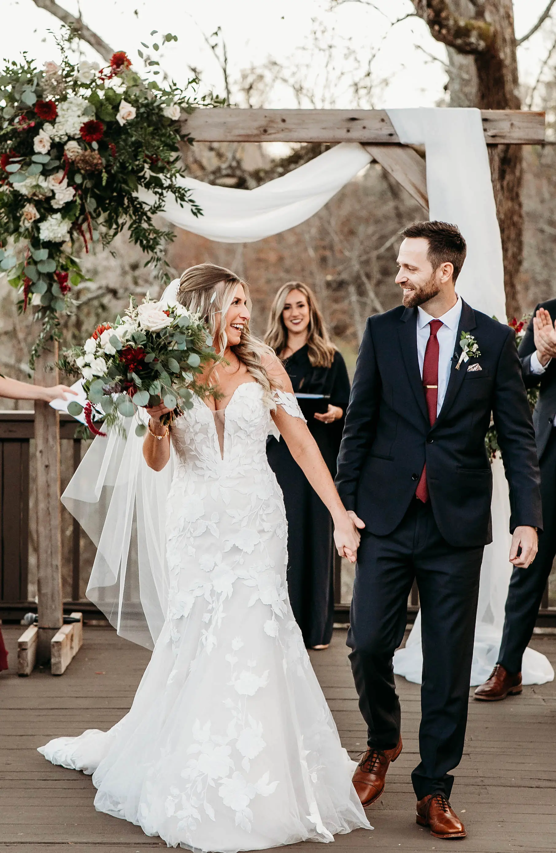 Bride And Groom Walking Down The Aisle Together. Bride Wearing Mermaid Wedding Dress With Oversized Lace Called Hattie By Rebecca Ingram