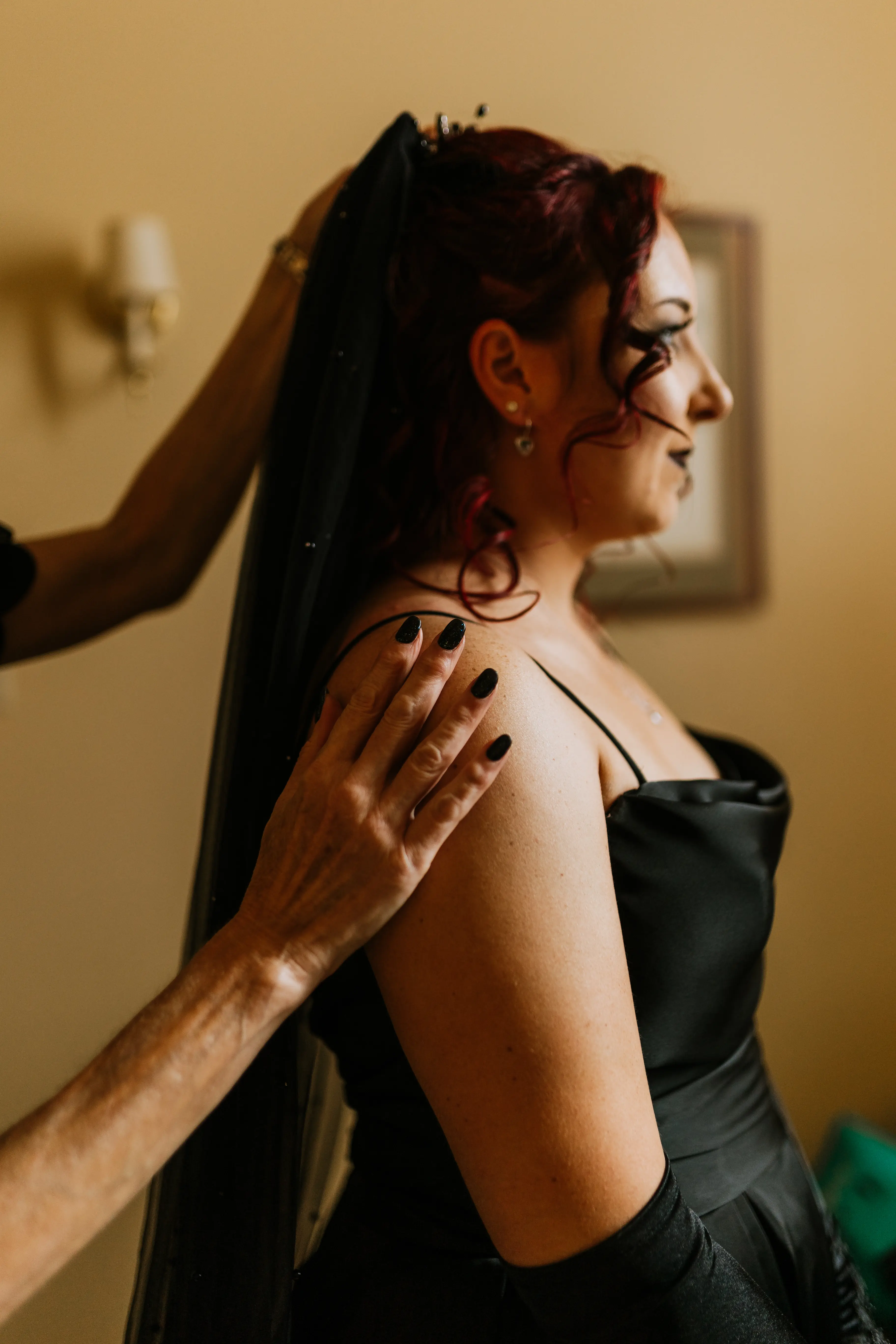 Bride Wearing Black Aline Wedding Dress Called Scarlet By Maggie Sottero Putting On Her Veil
