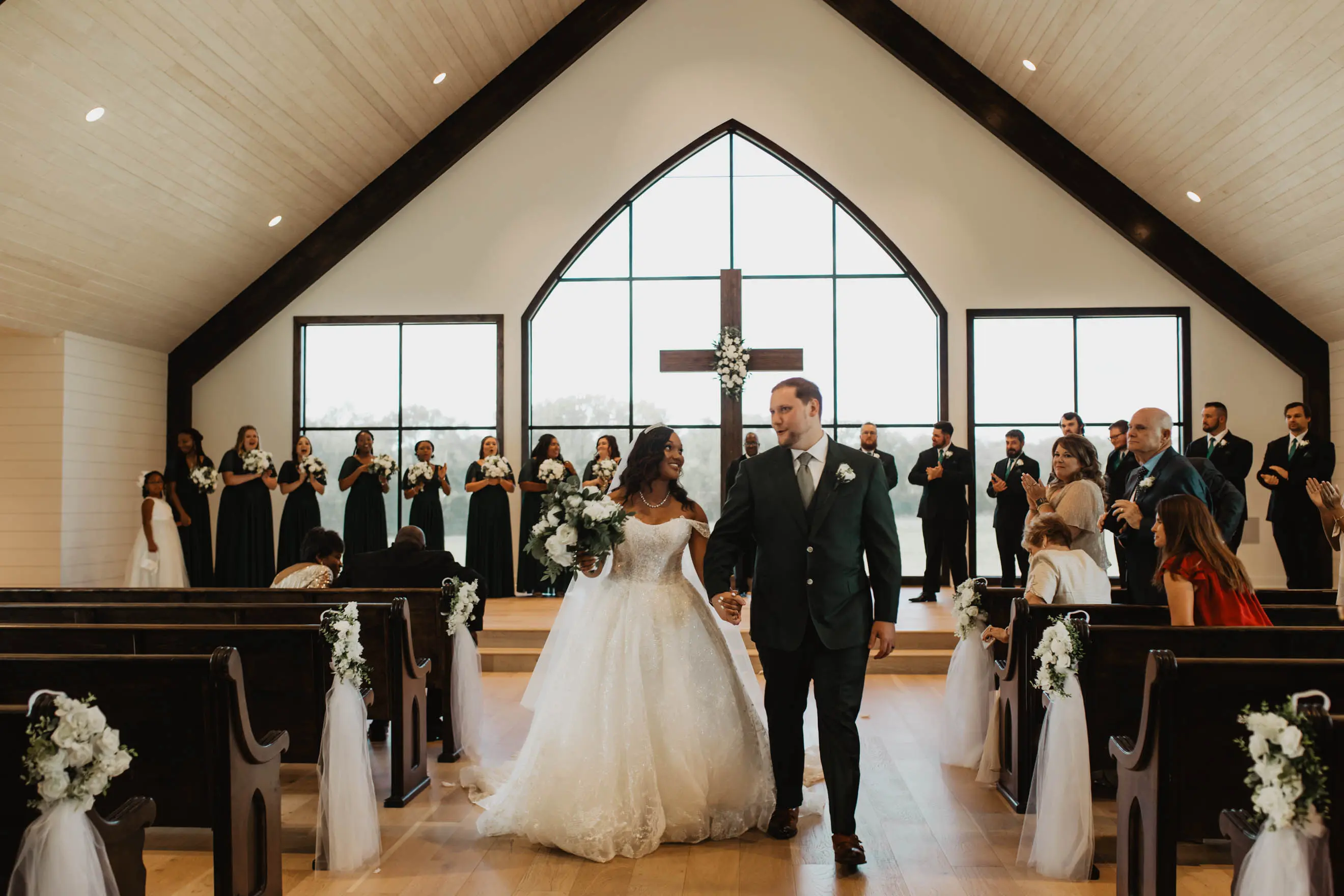 Bride Wearing Sparkly Ballgown Wedding Dress Called Zartasha By Sottero and Midgley Leaving The Church After The Ceremony
