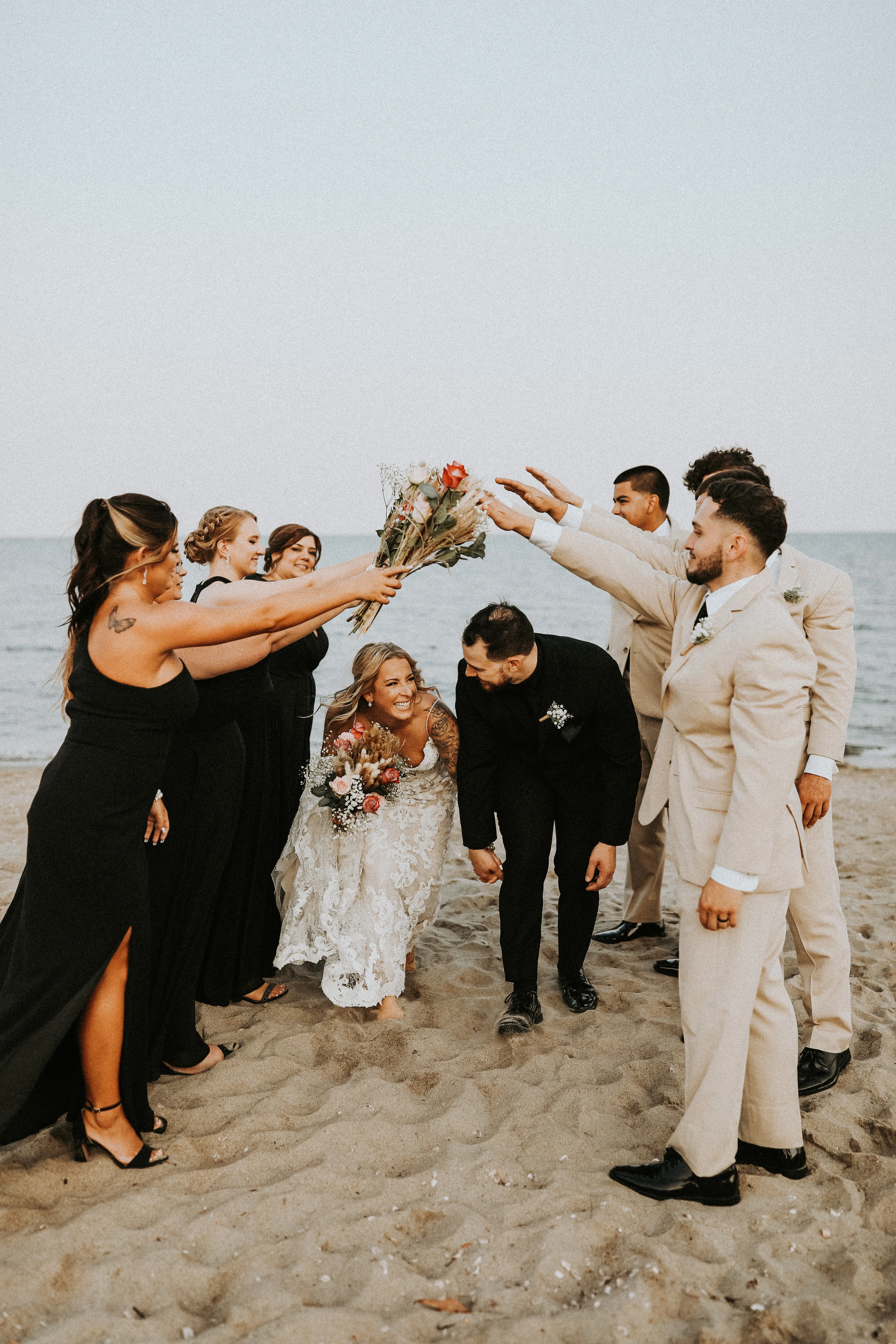 Bride In Lace Sheath Wedding Gown Name Tuscany Lynette By Maggie Sottero Bride And Groom With Wedding Party