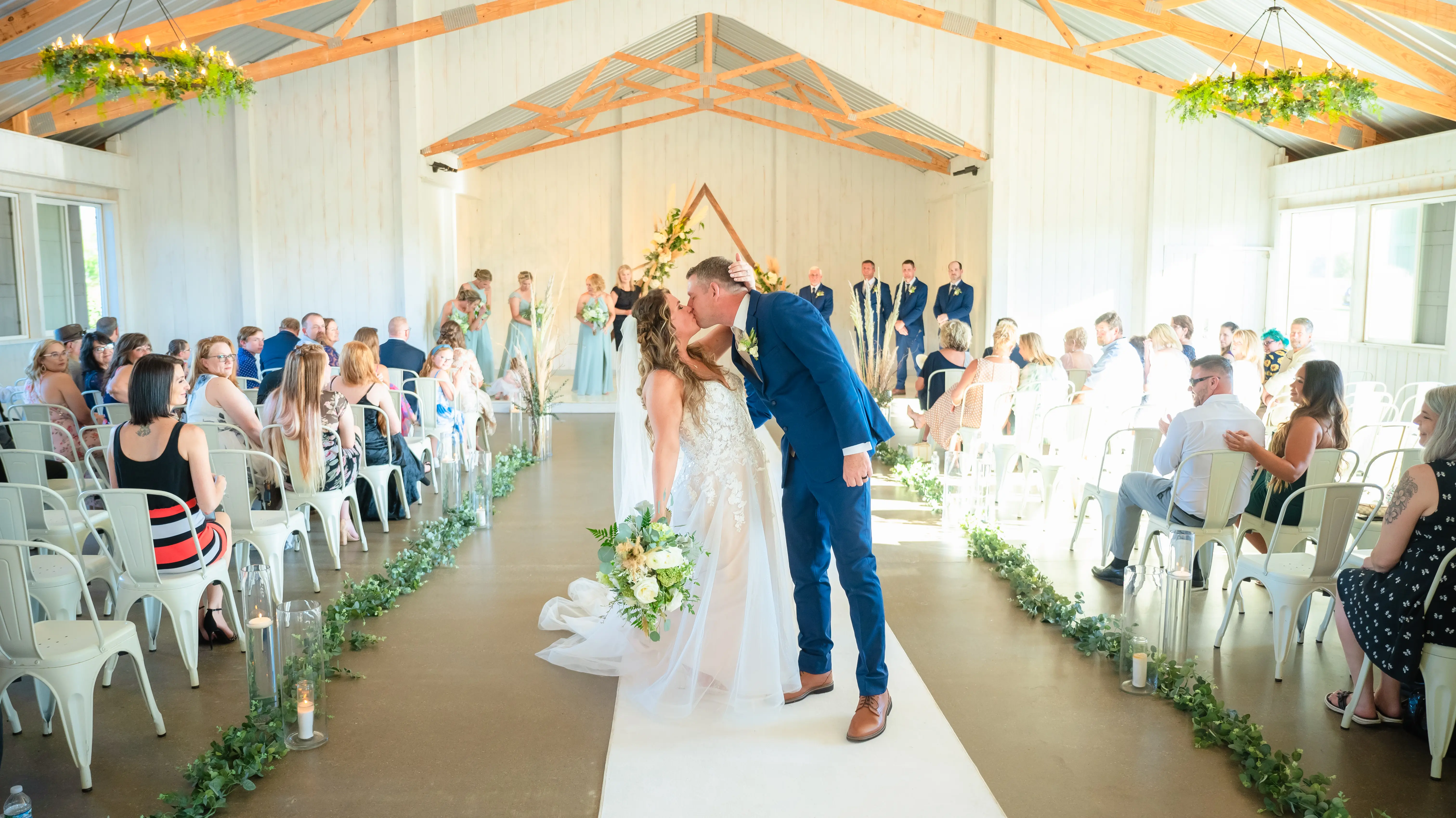 Bride Wearing Lace Princess Wedding Dress Called Stevie By Maggie Sottero Kissing Groom