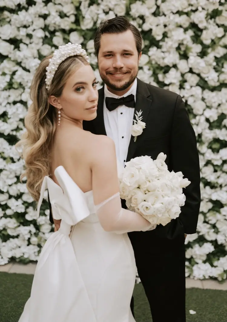 Groom With Bride Wearing Simple Sheath Satin Dress With Back Bow Mitchell By Maggie Sottero