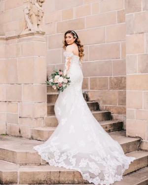 Bride Wearing Lace Sheath Wedding Dress Called Fiona By Maggie Sottero Walking Up Steps