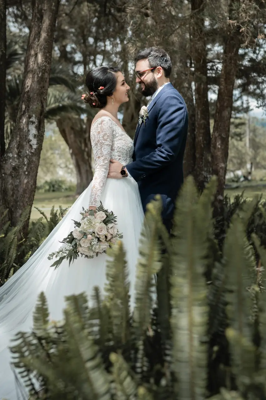 Bride in Long Sleeve Ball Gown Wedding Dress Named Mallory Dawn by Maggie Sottero with Groom