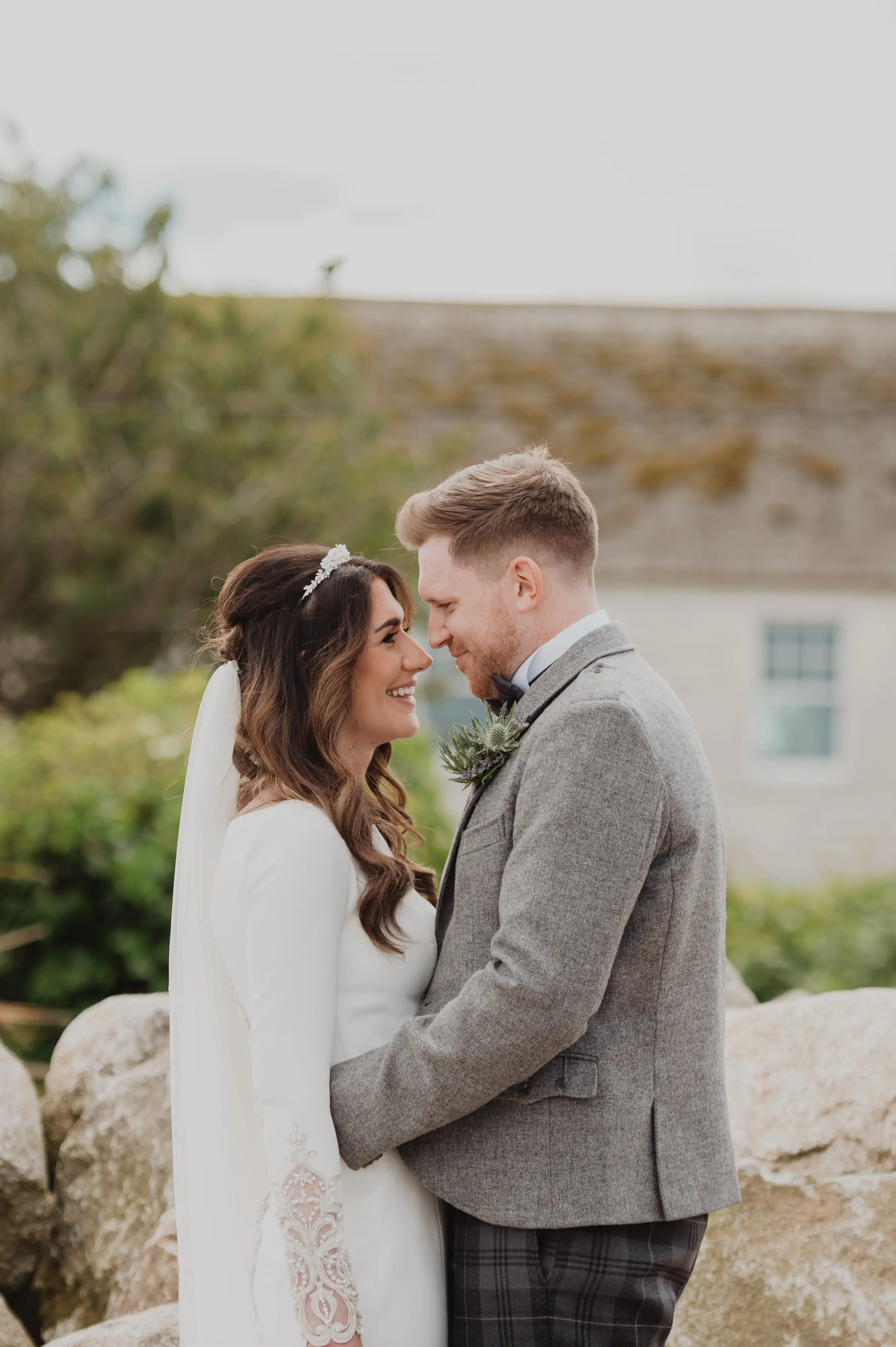 Real Bride in Crepe Fit-and-Flare Wedding Dress with a Statement Back of Beaded Illusion Embroidery Featuring Swarovski Crystals Called Aston by Sottero & Midgely