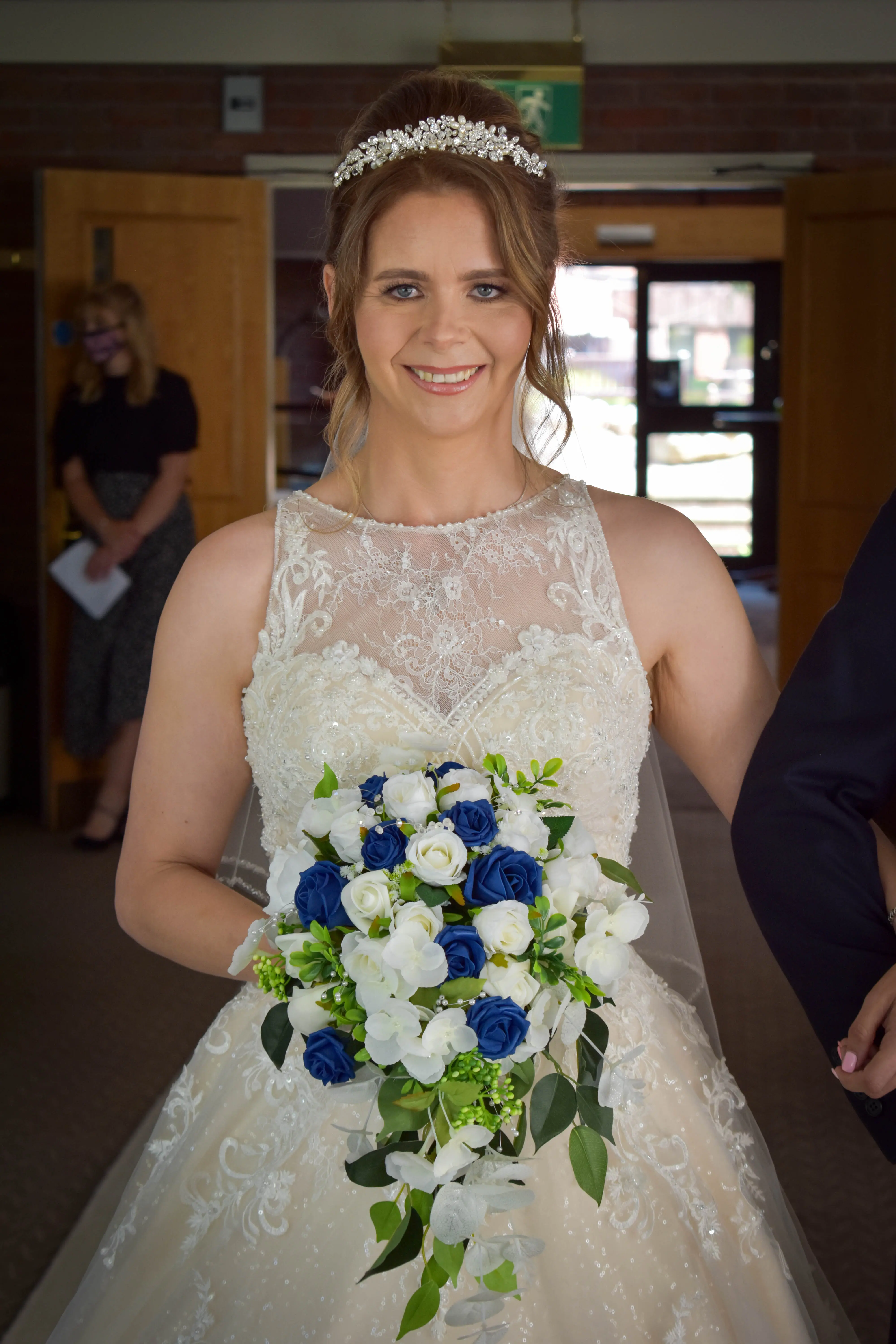 Bride wearing a lace and tulle ballgown wedding dress