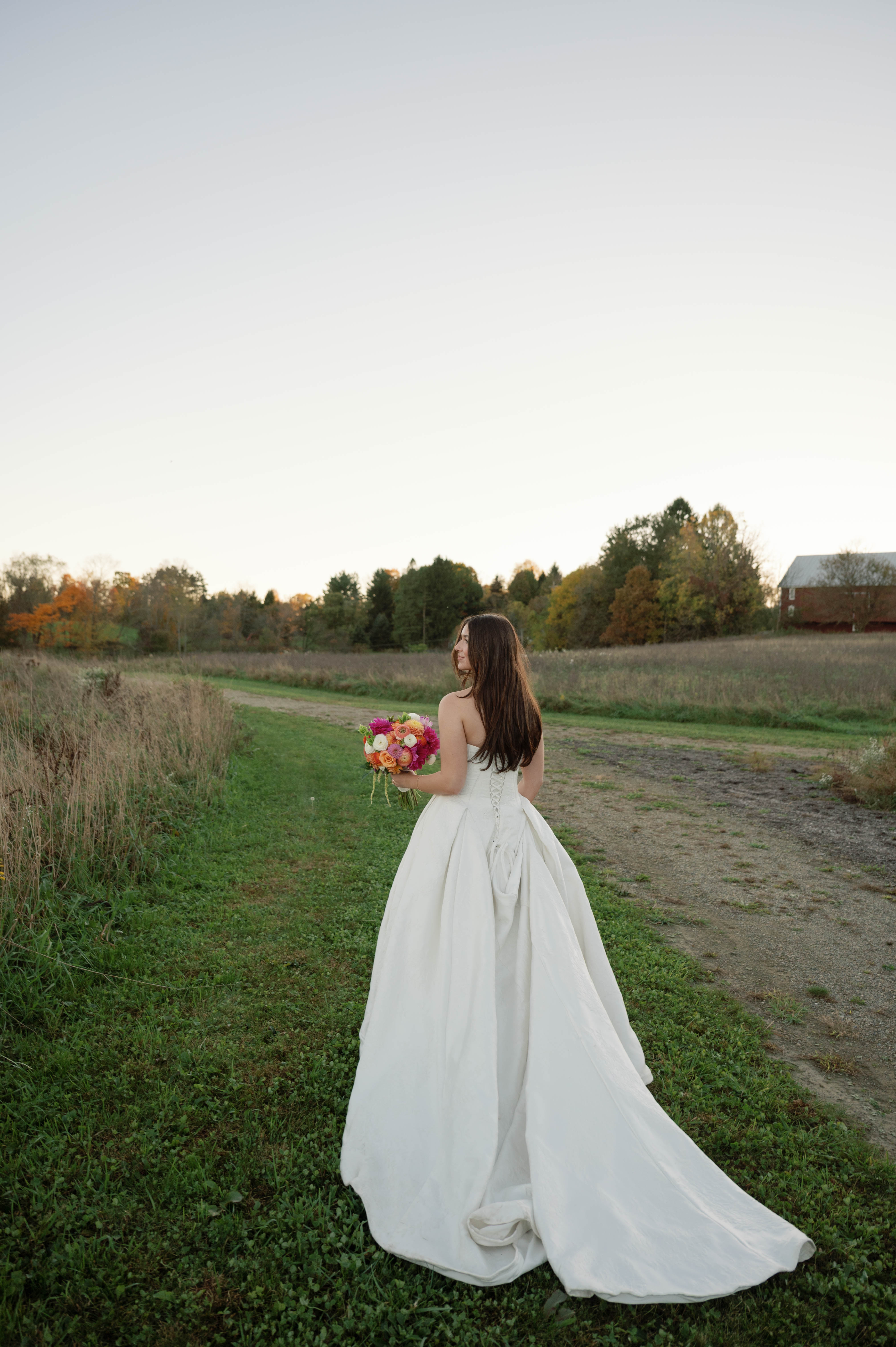 Bride Wearing Jacquard Ballgown Wedding Dress Called Fortune Marie By Maggie Sottero In A Field