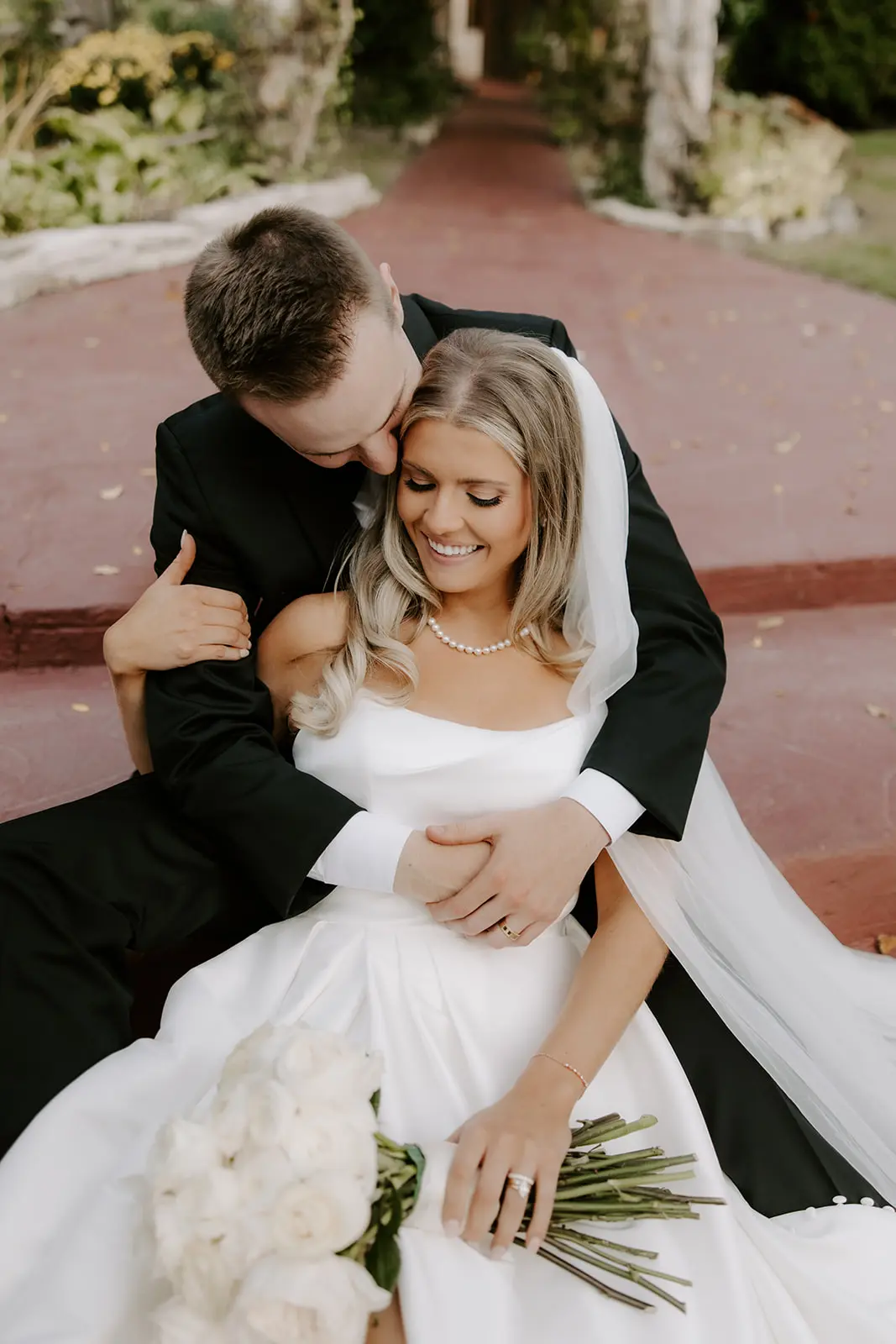Bride Wearing Simple Aline Wedding Dress Called Aspen By Sottero And Midgley With Groom Holding Her