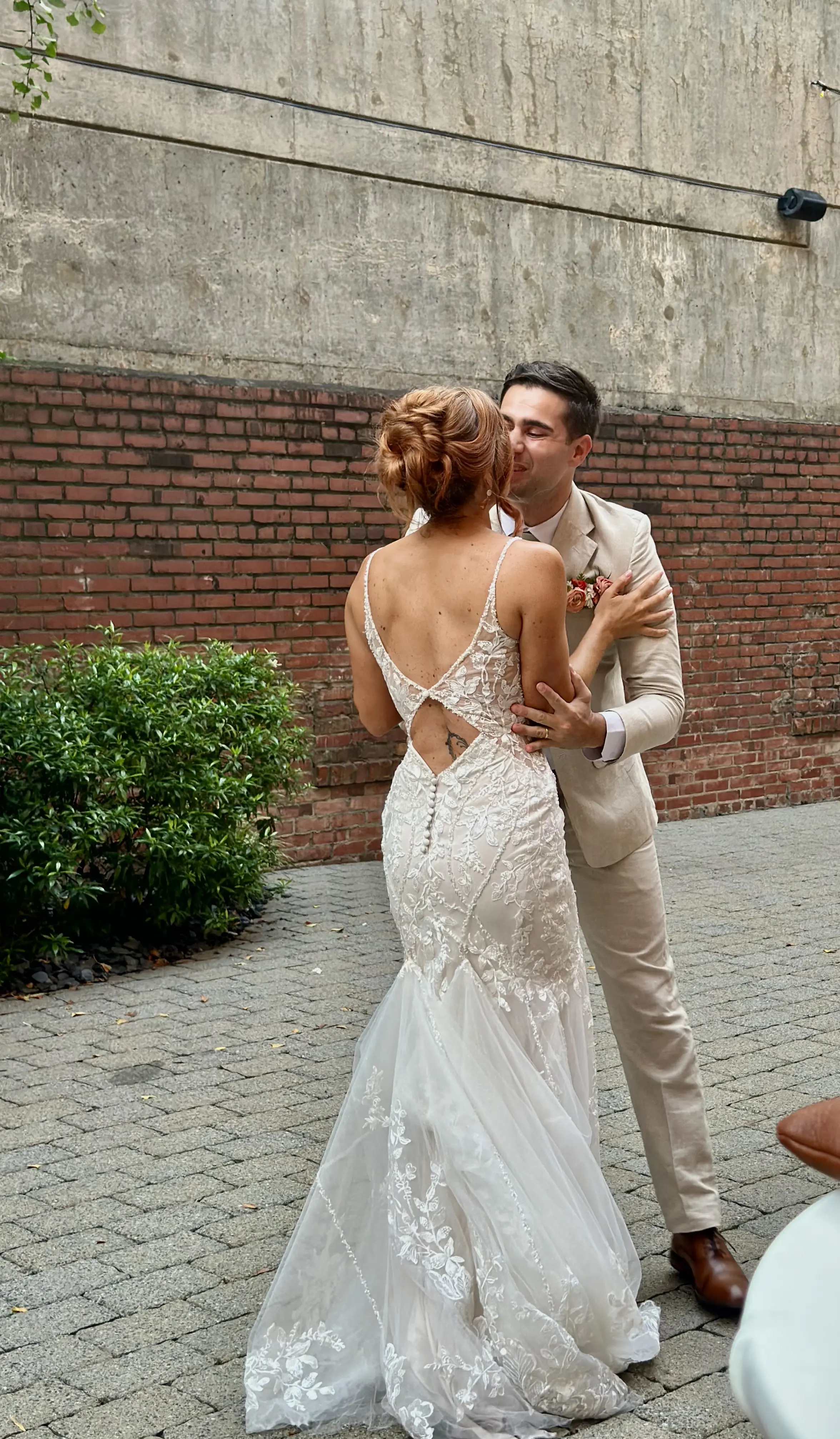 Bride wearing Sydney by Maggie Sottero kissing her husband