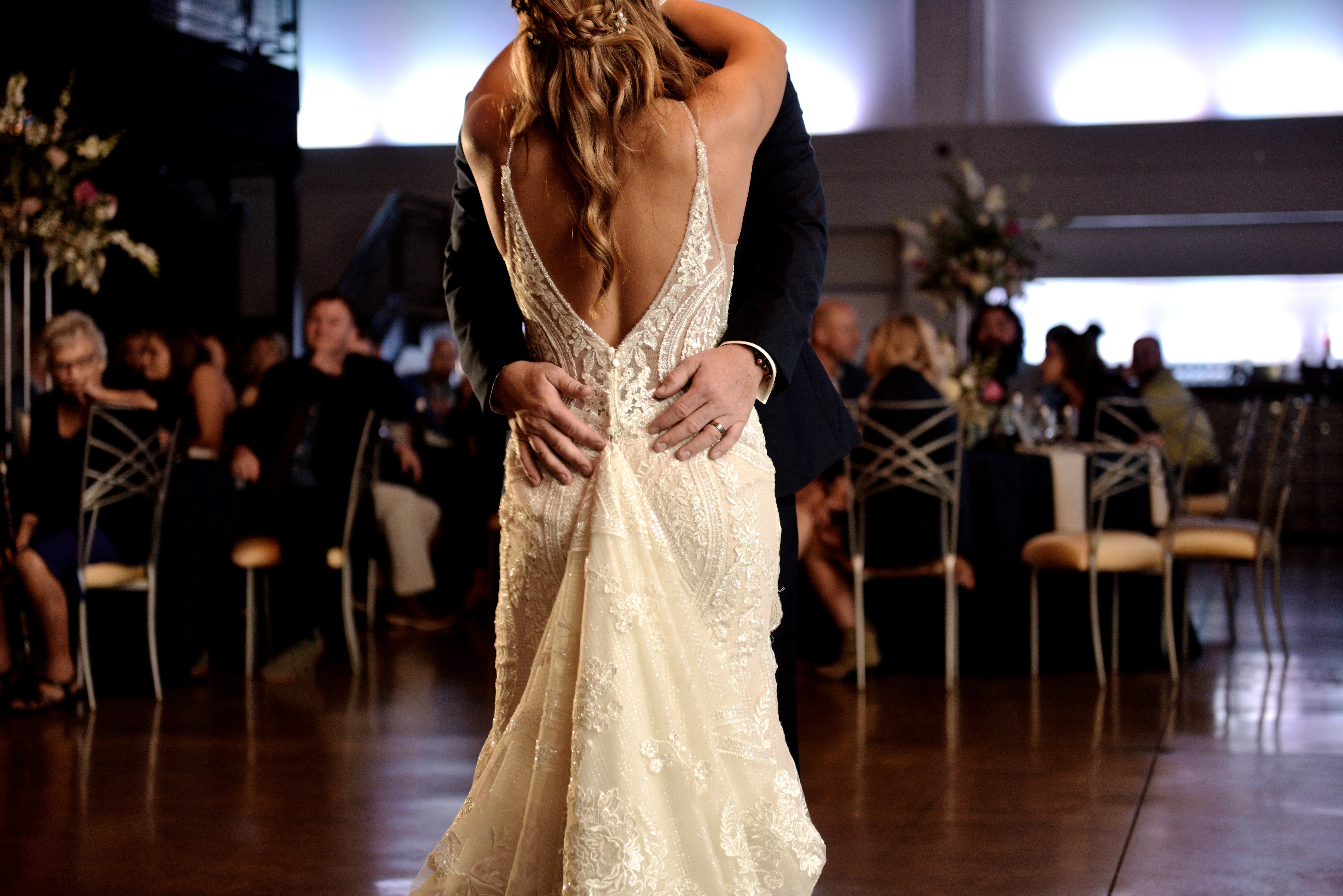 Groom Dancing With Bride in V-Neckline Wedding Gown Accented with Beaded Detail Called Bailey by Sottero & Midgley