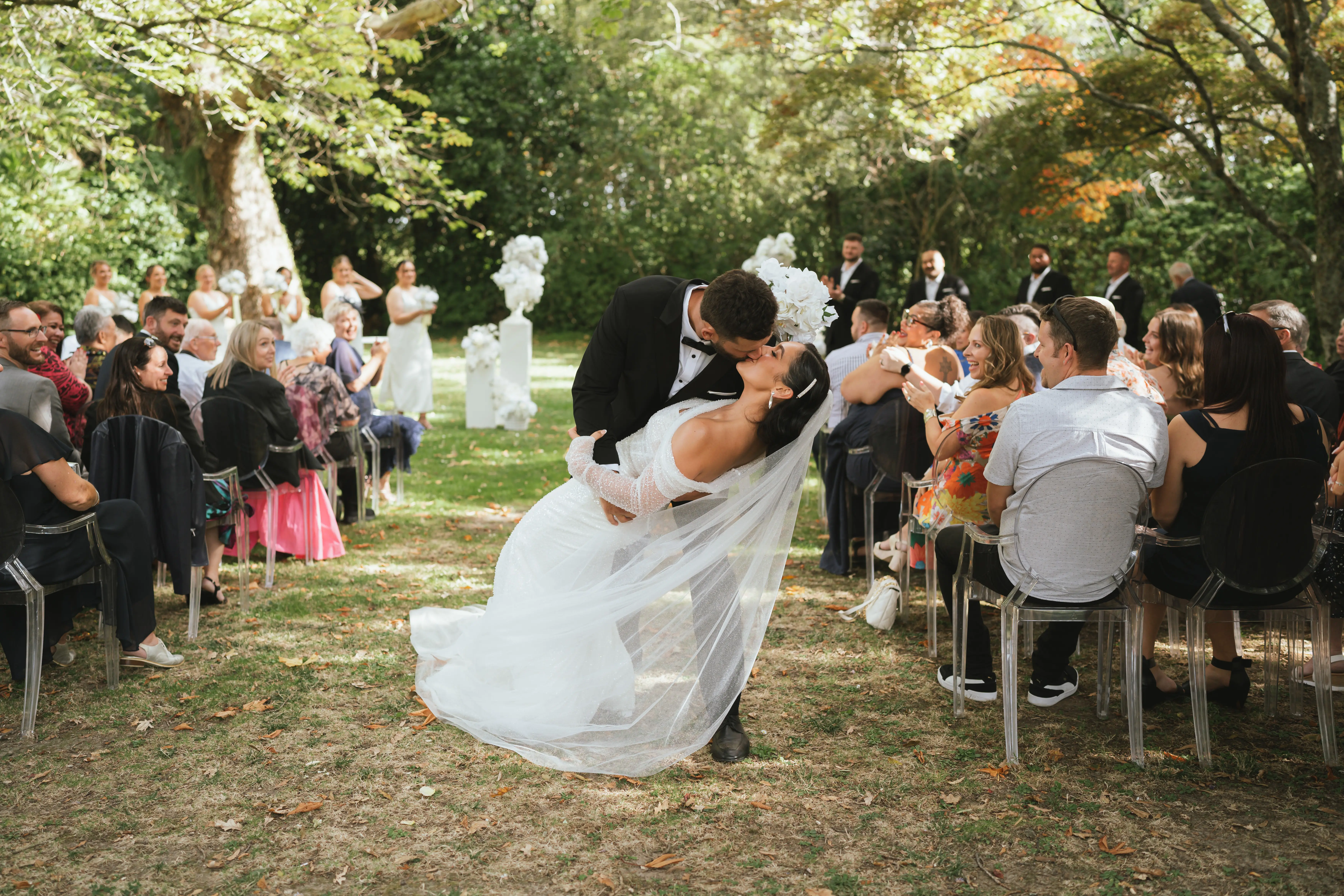Bride wearing Drew by Maggie Sottero kissing her husband
