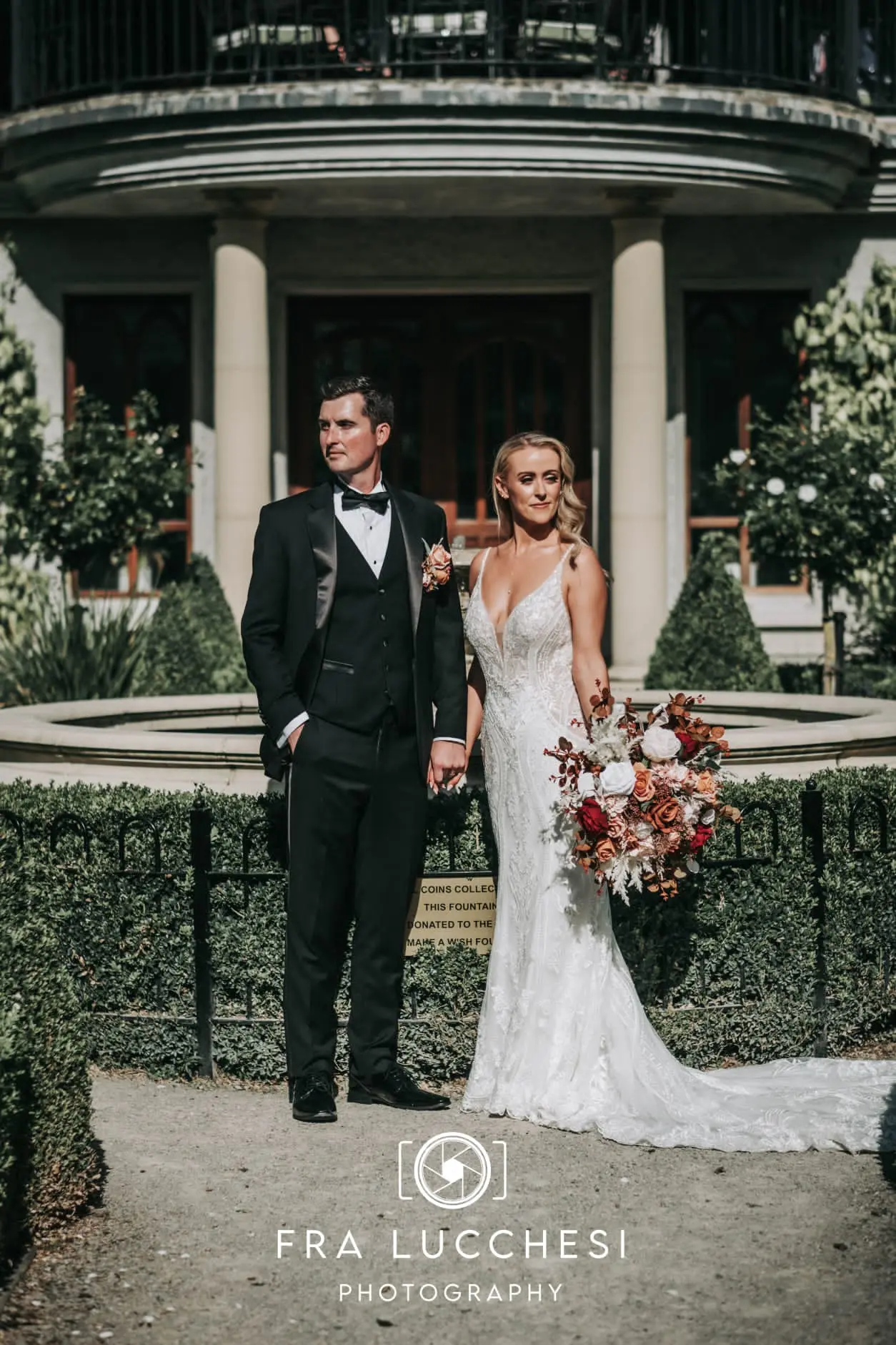 Bride wearing Bailey wedding dress by Sottero and Midgley with her husband