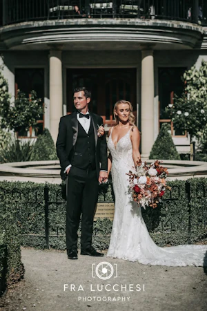 Bride wearing Bailey wedding dress by Sottero and Midgley with her husband