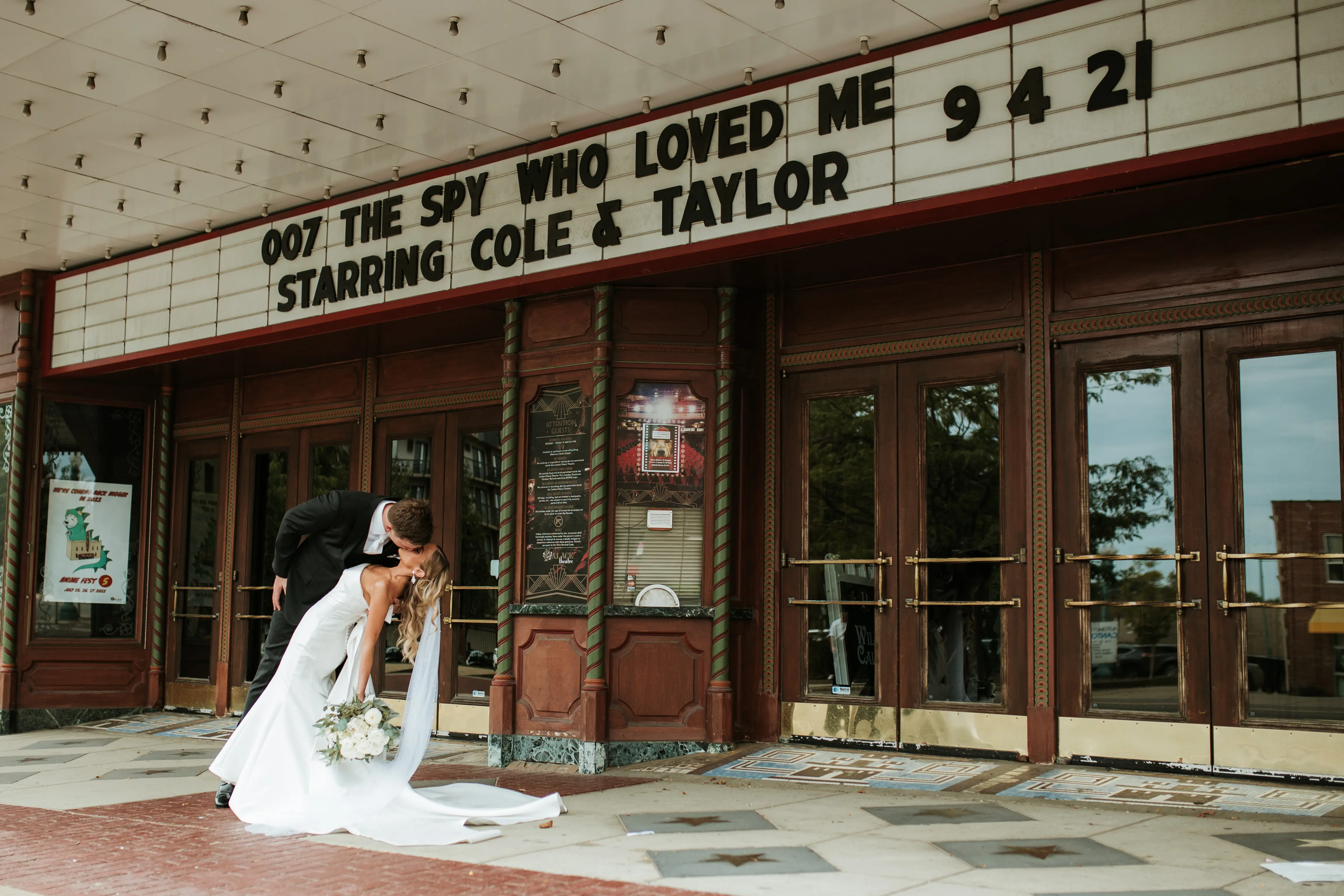 Bride with groom wearing unique strapless wedding dress