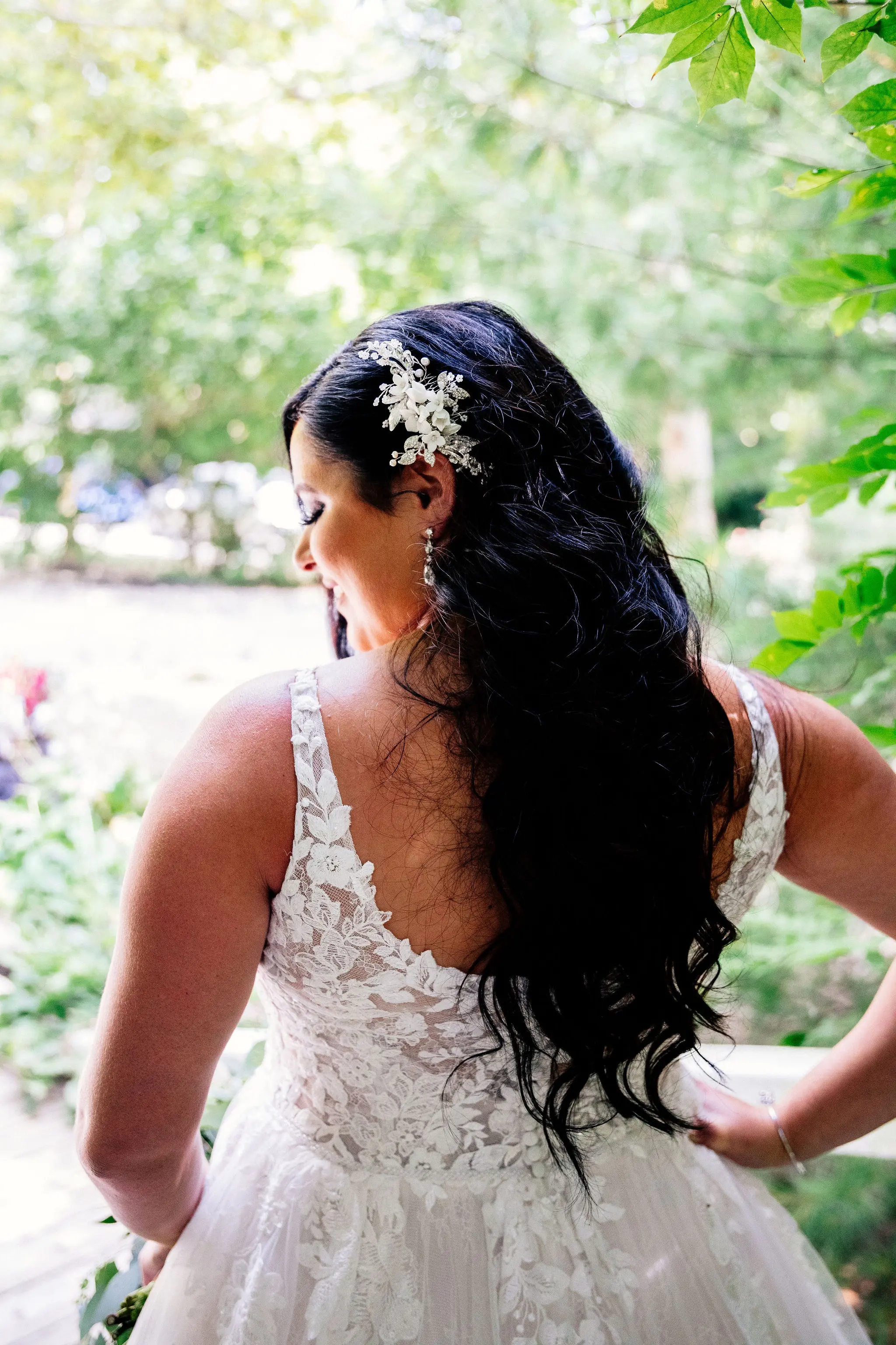 Bride wearing wedding dress called Valona with hair down.