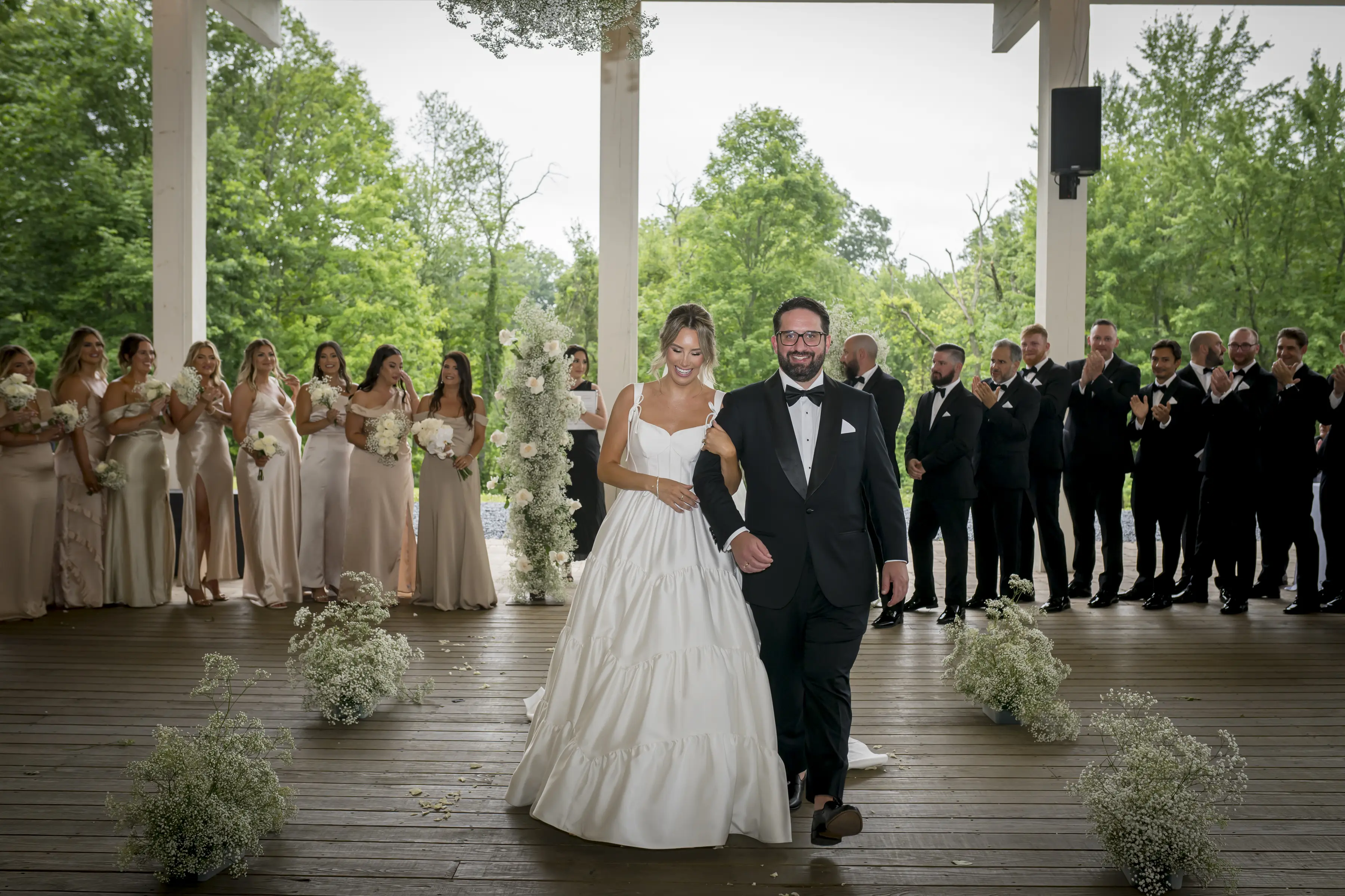 Bride wearing Talitha by Sottero and Midgley walking with her husband