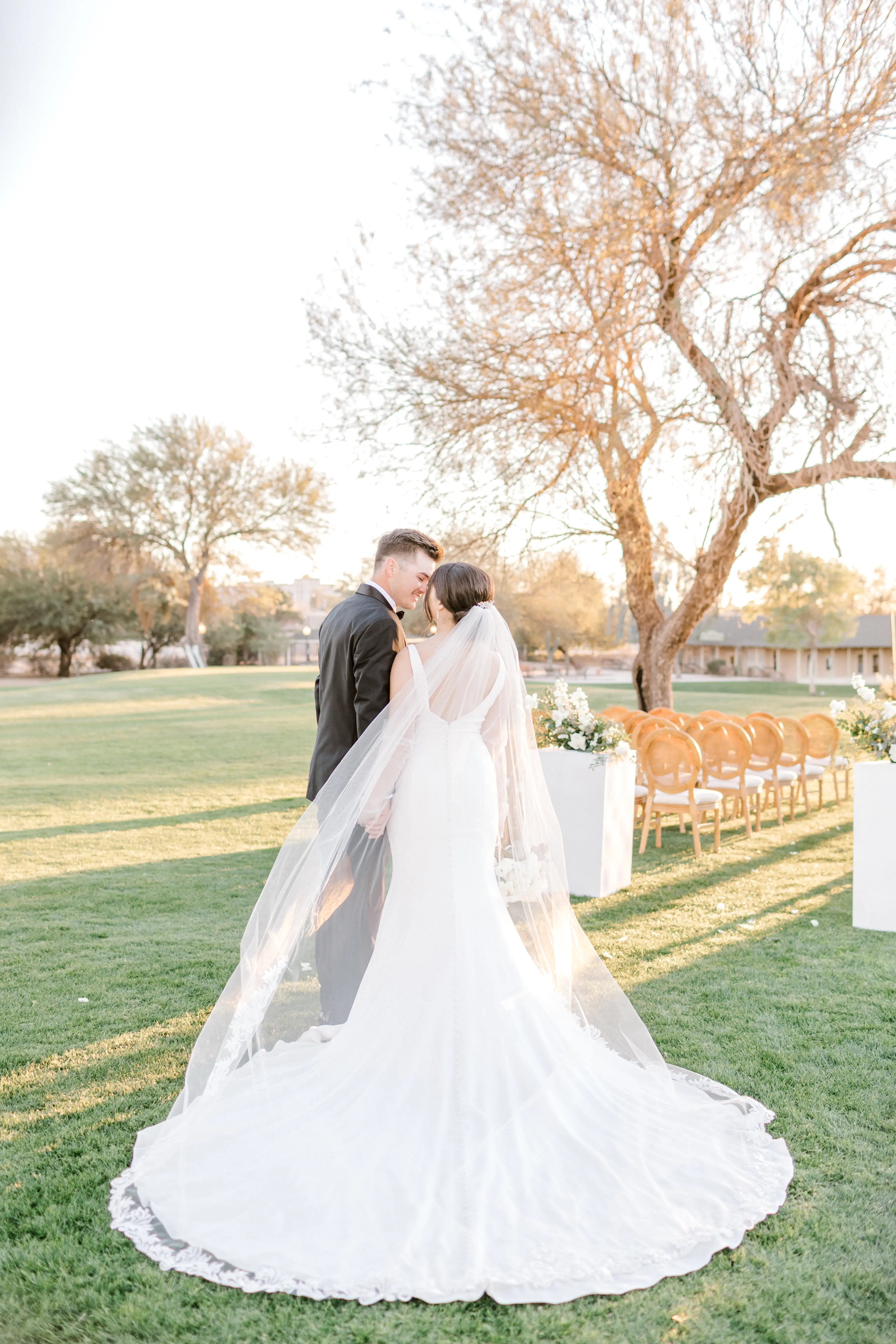 Bride In Simple Crepe Wedding Dress Called Fernanda By Maggie Sottero With Groom and Veil