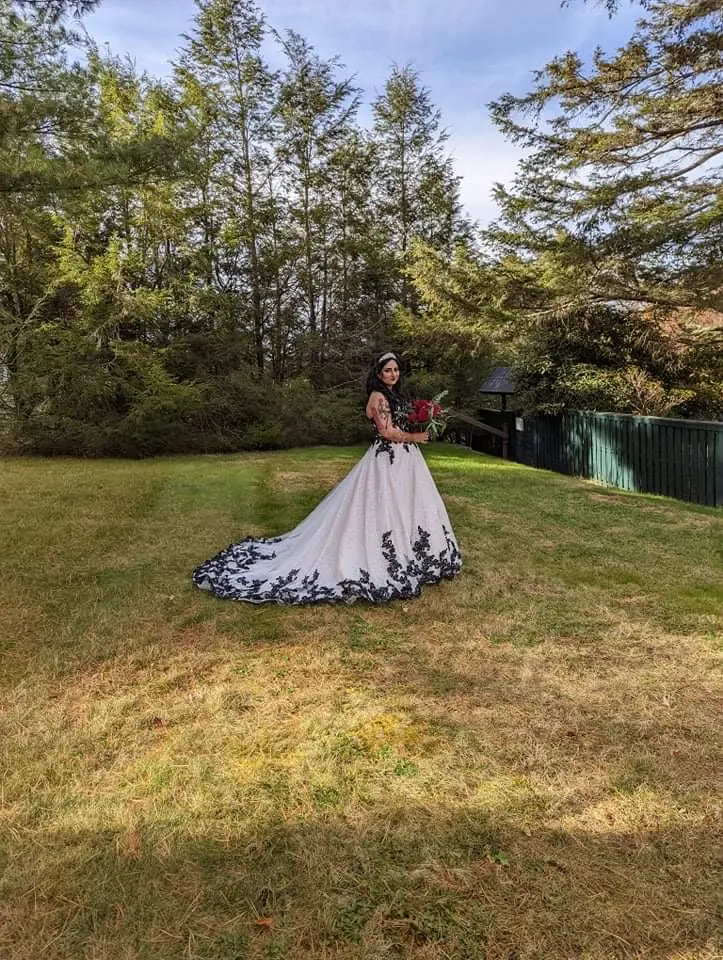 Bride wearing Black Lace Ballgown Wedding Dress called Tristyn by Maggie Sottero