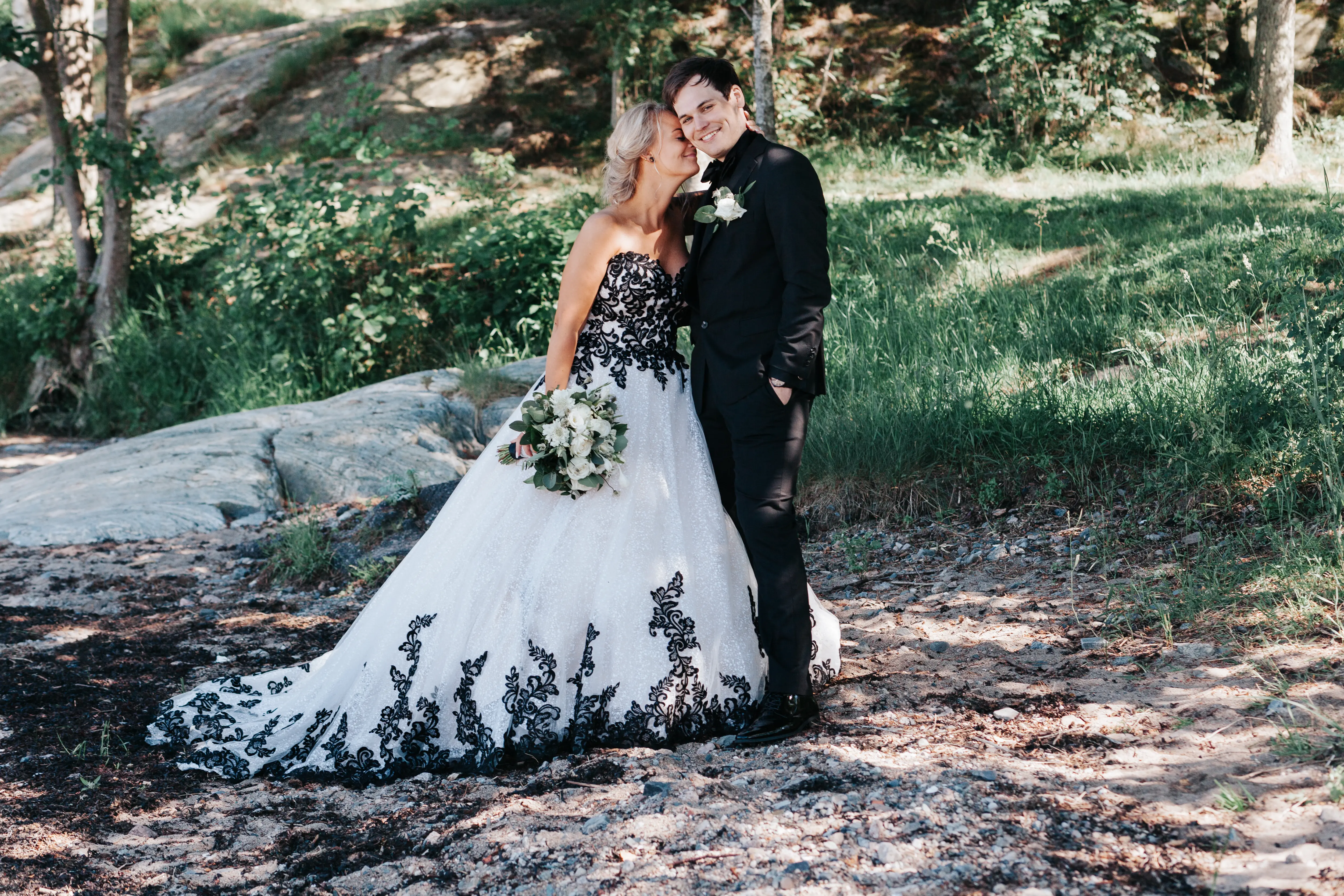 Groom With Bride Wearing Ballgown With Black Lace Detail Called Tristyn By Maggie Sottero