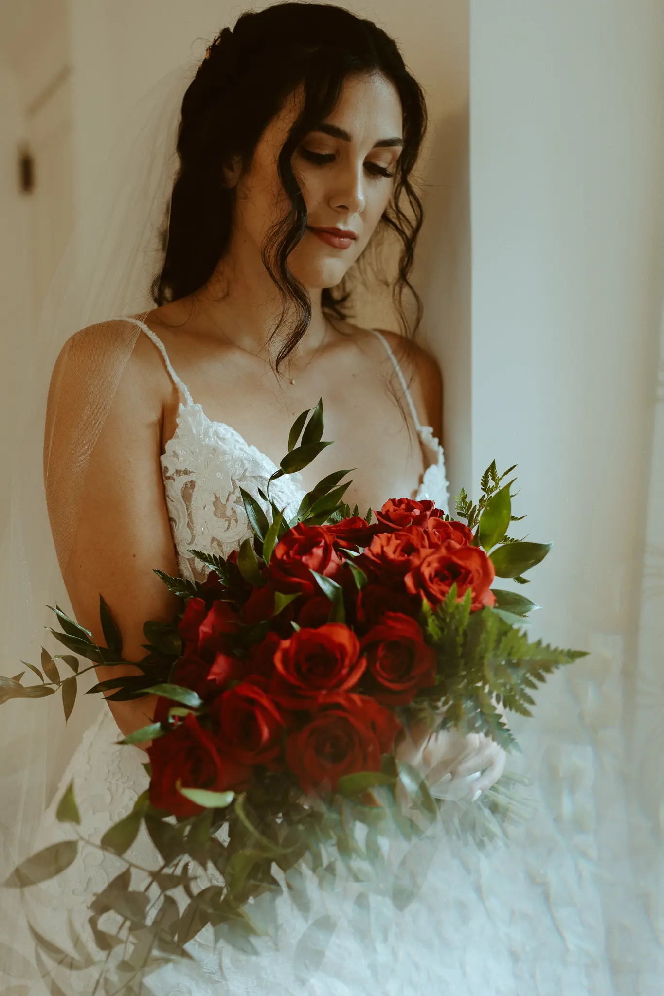Bride wearing lace sheath wedding dress.