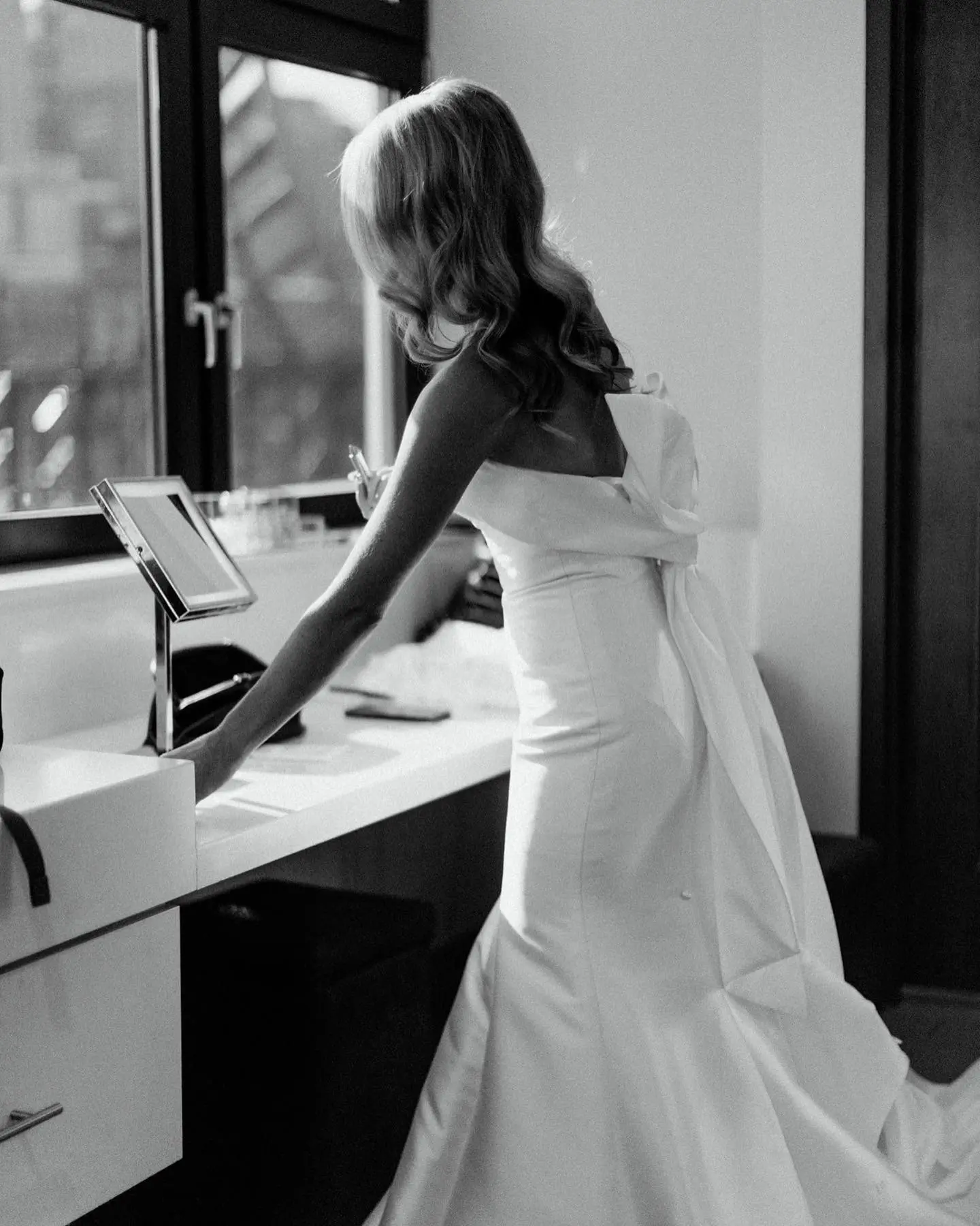 Bride Wearing Unique Strapless Wedding Dress With Beautiful Back Bow Mitchell By Maggie Sottero