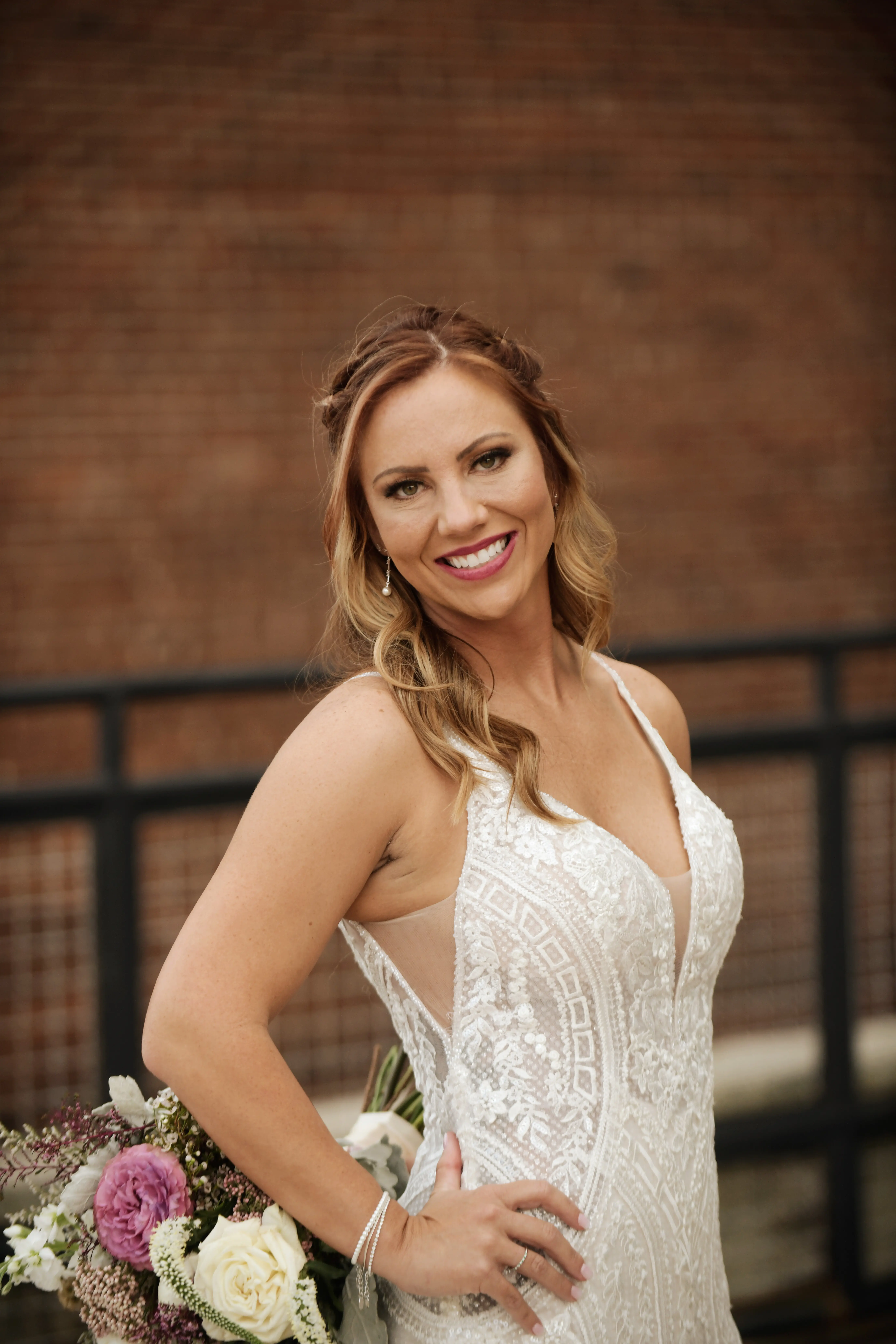Bride in V-Neckline Wedding Gown Accented with Beaded Detail Called Bailey by Sottero & Midgley