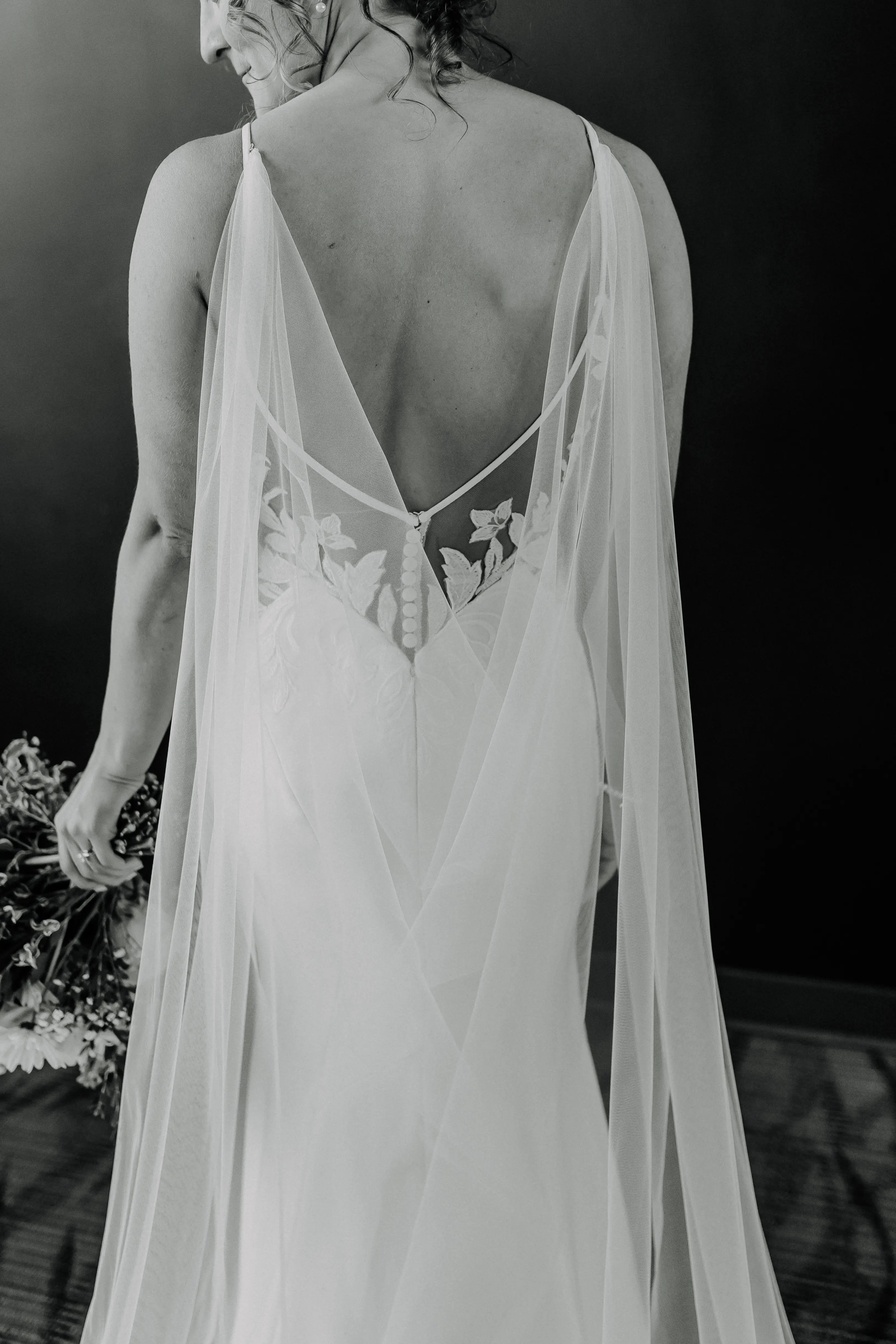 Bride wearing Dionne by Rebecca Ingram and a cape