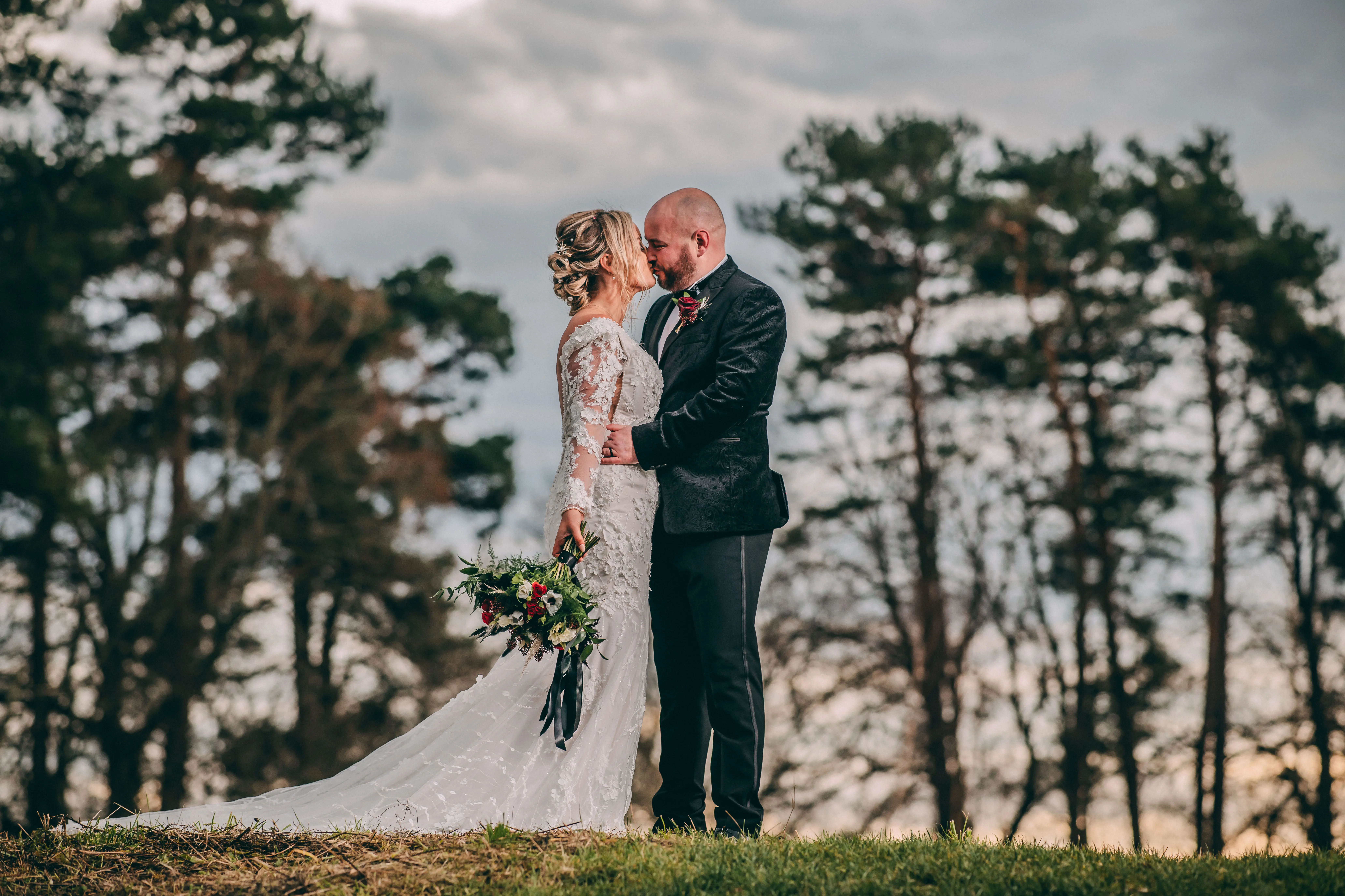 Groom With Bride Wearing Vintage Mermaid Wedding Dress With 3-D Floral Motifs Cruz By Sottero And Midgley