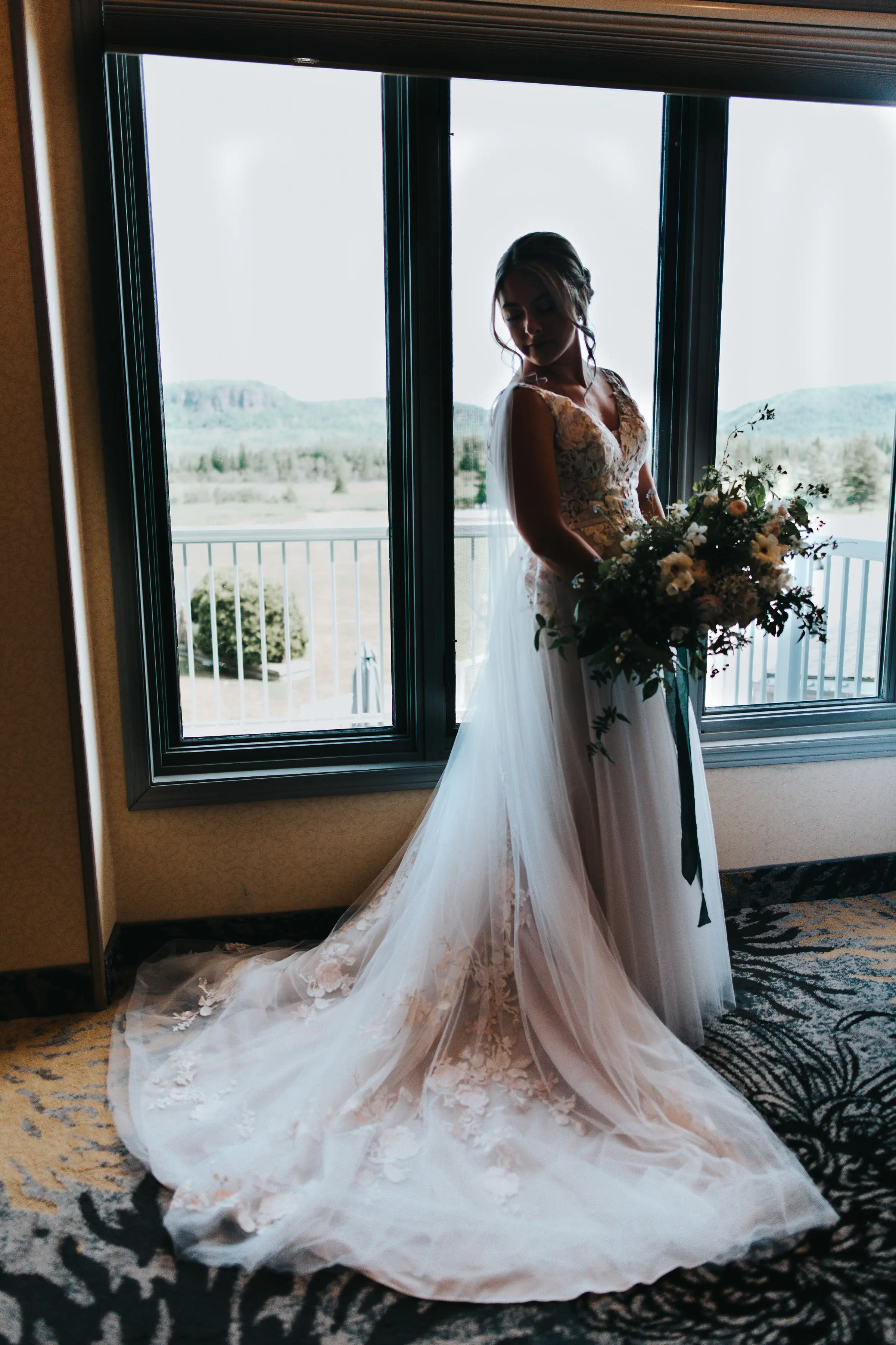 Bride Wearing V-Neck A-Line Wedding Dress Minerva By Rebecca Ingram