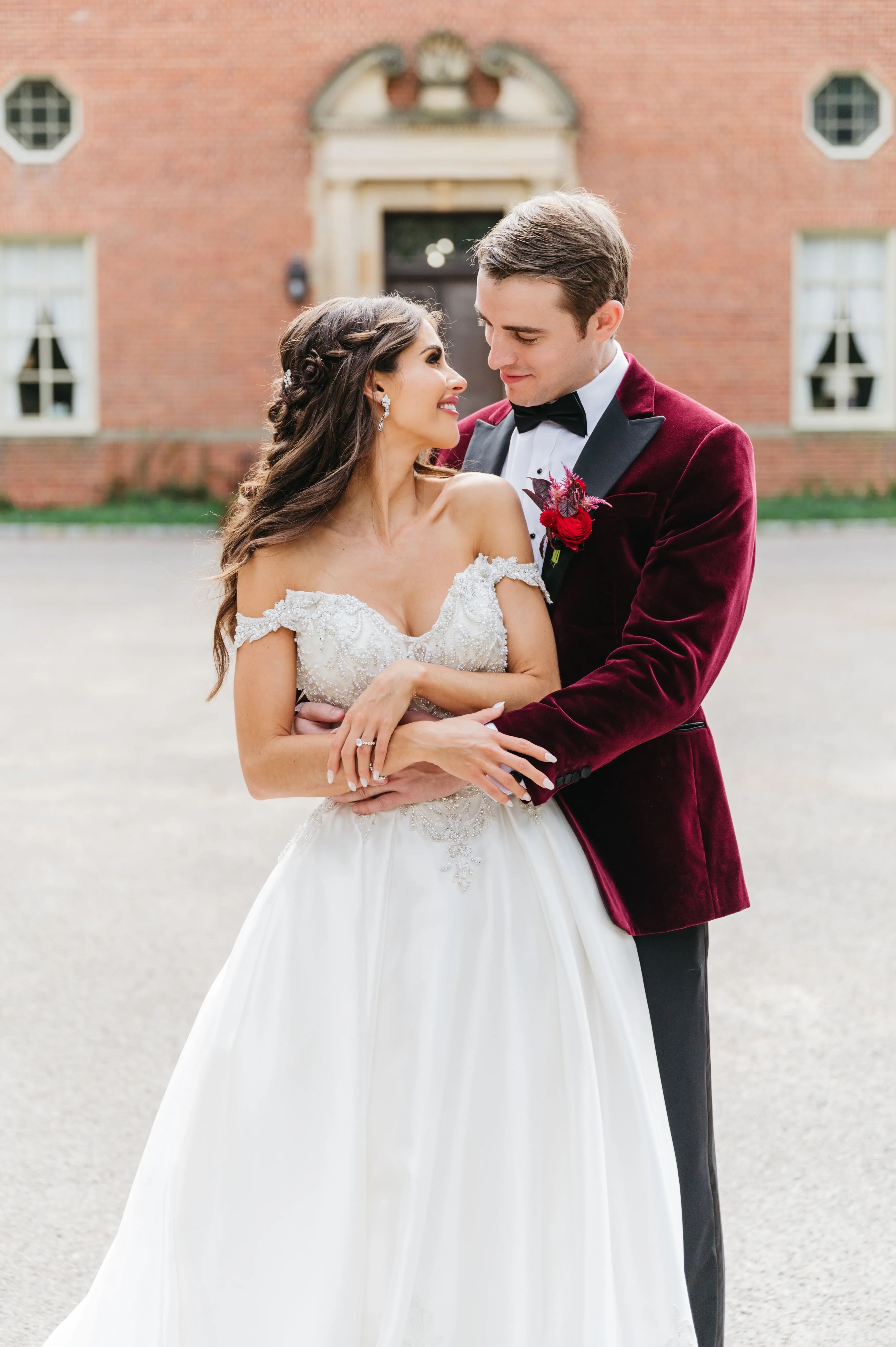 Bride In Satin Ballgown Wedding Dress Called Kimora By Sottero And Midgley With Groom In Velvet Red Suit