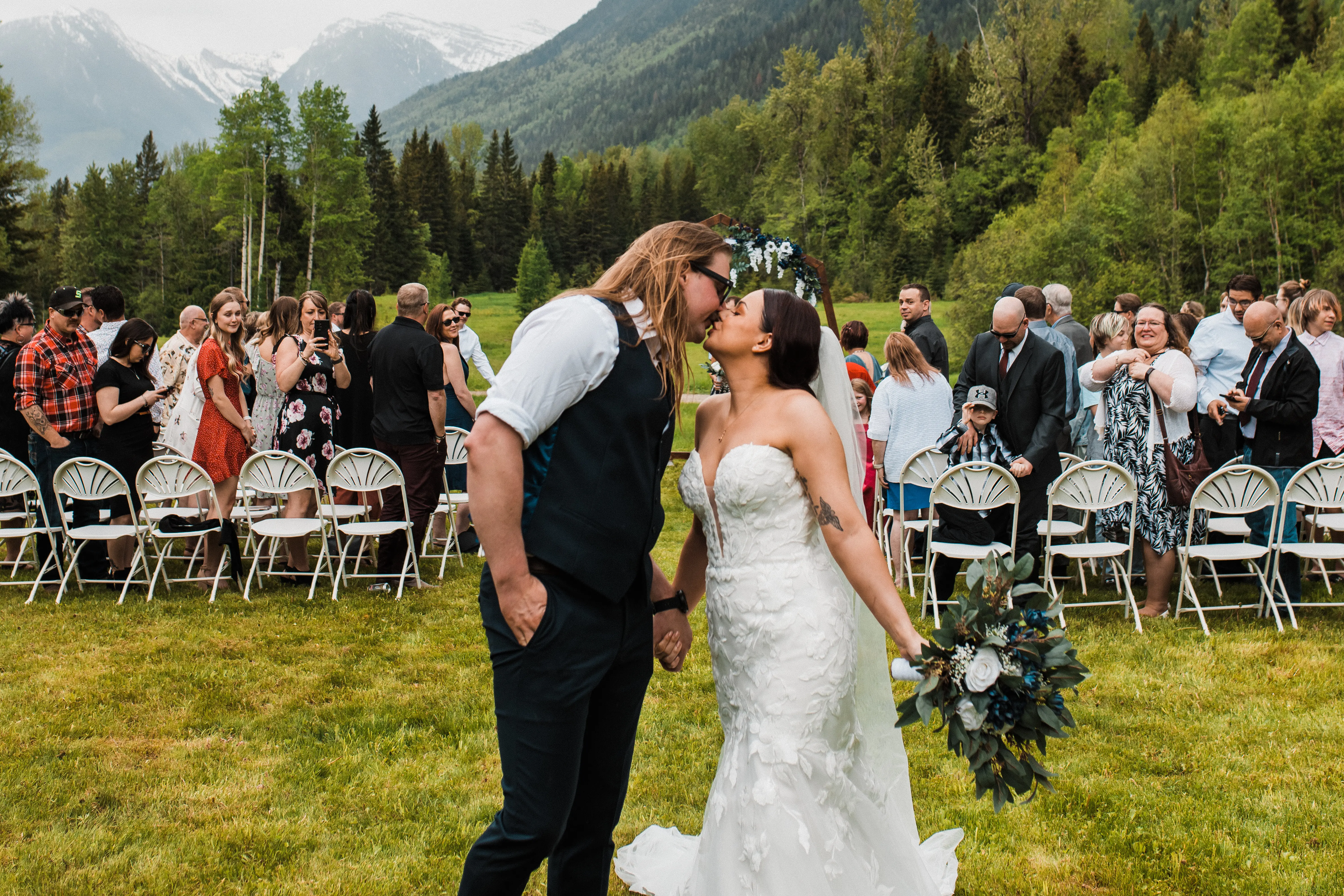 Groom Kisses Bride Wearing A Floral Lace Mermaid Wedding Dress Called Hattie By Maggie Sottero