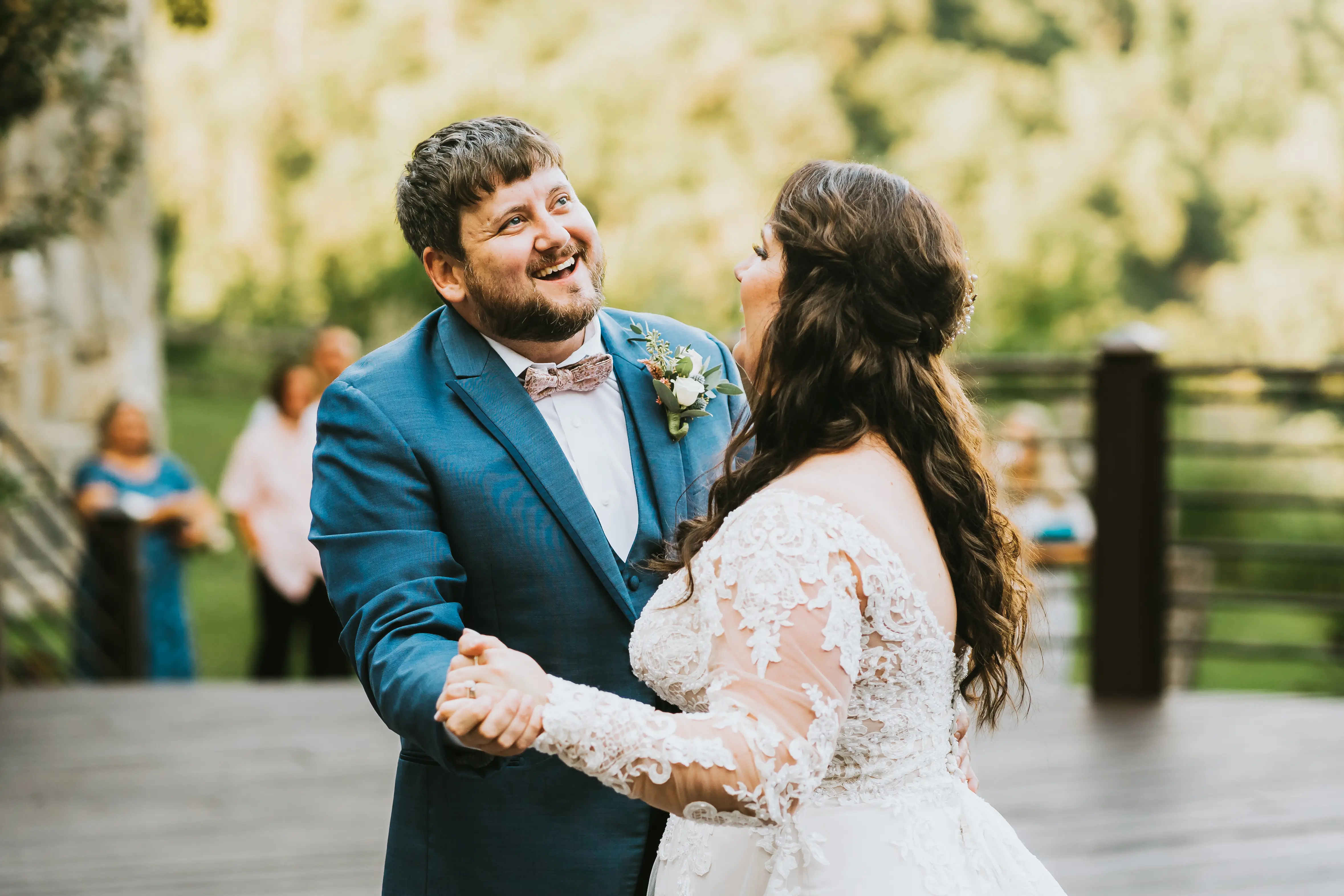 Bride Wearing Shimmery Princess Bridal Gown Called Tiffany By Maggie Sottero Dancing With Long Sleeves