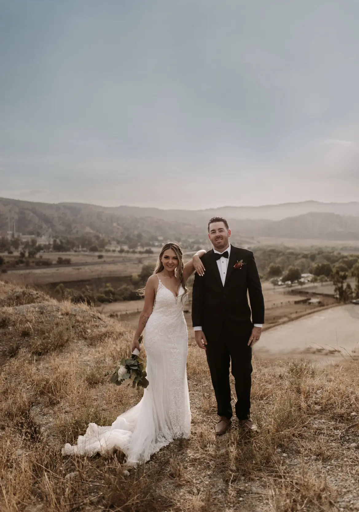 Bride In Beaded Fit-And-Flare Wedding Dress Called Barrett By Sottero And Midgley With Groom