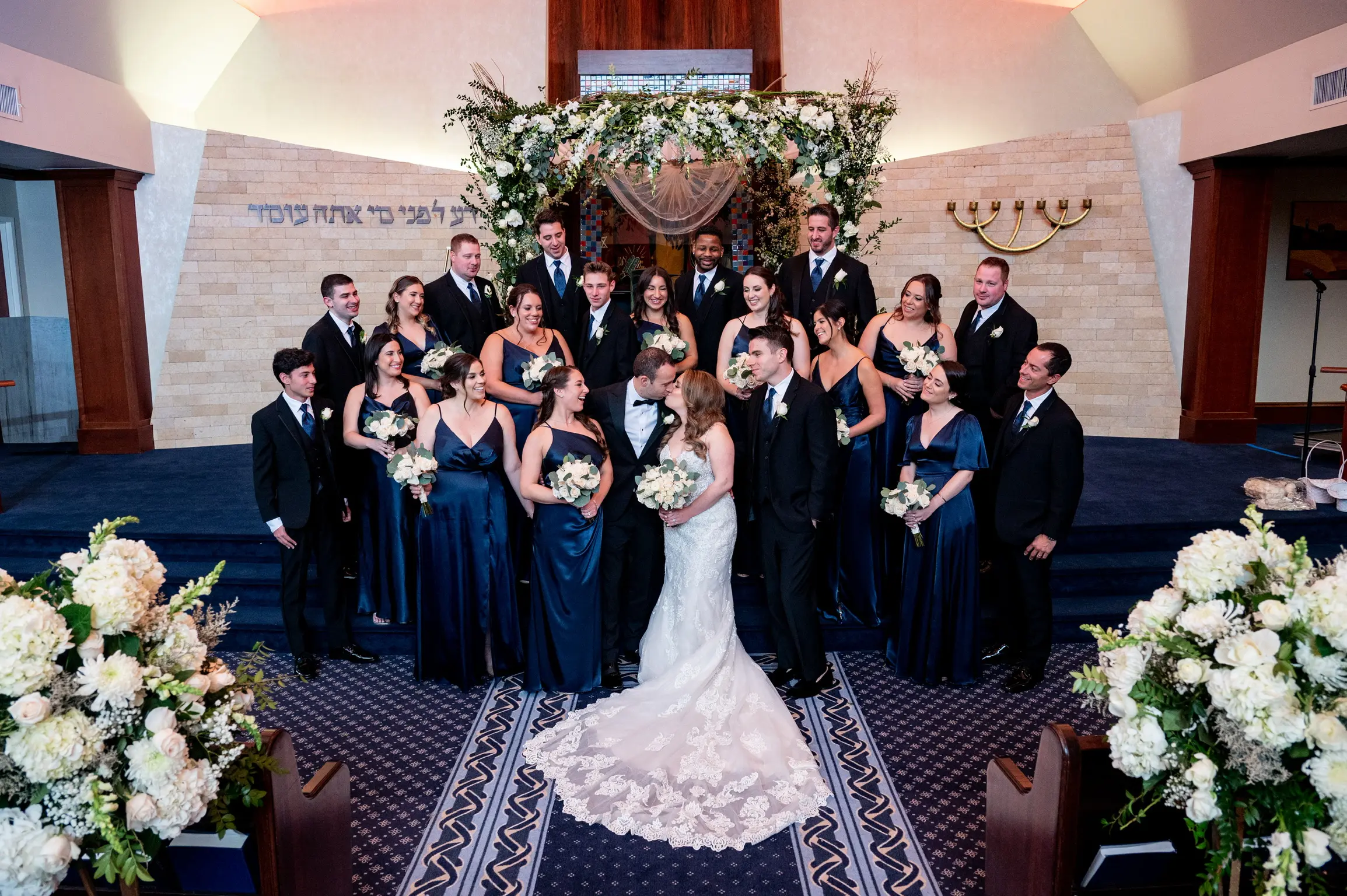 Bride Wearing Lace Fit-And-Flare Wedding Dress Called Fiona By Maggie Sottero With Bridal Party