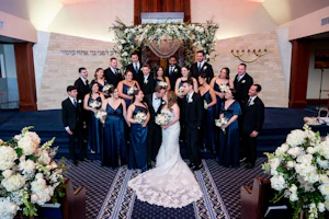 Bride Wearing Lace Fit-And-Flare Wedding Dress Called Fiona By Maggie Sottero With Bridal Party