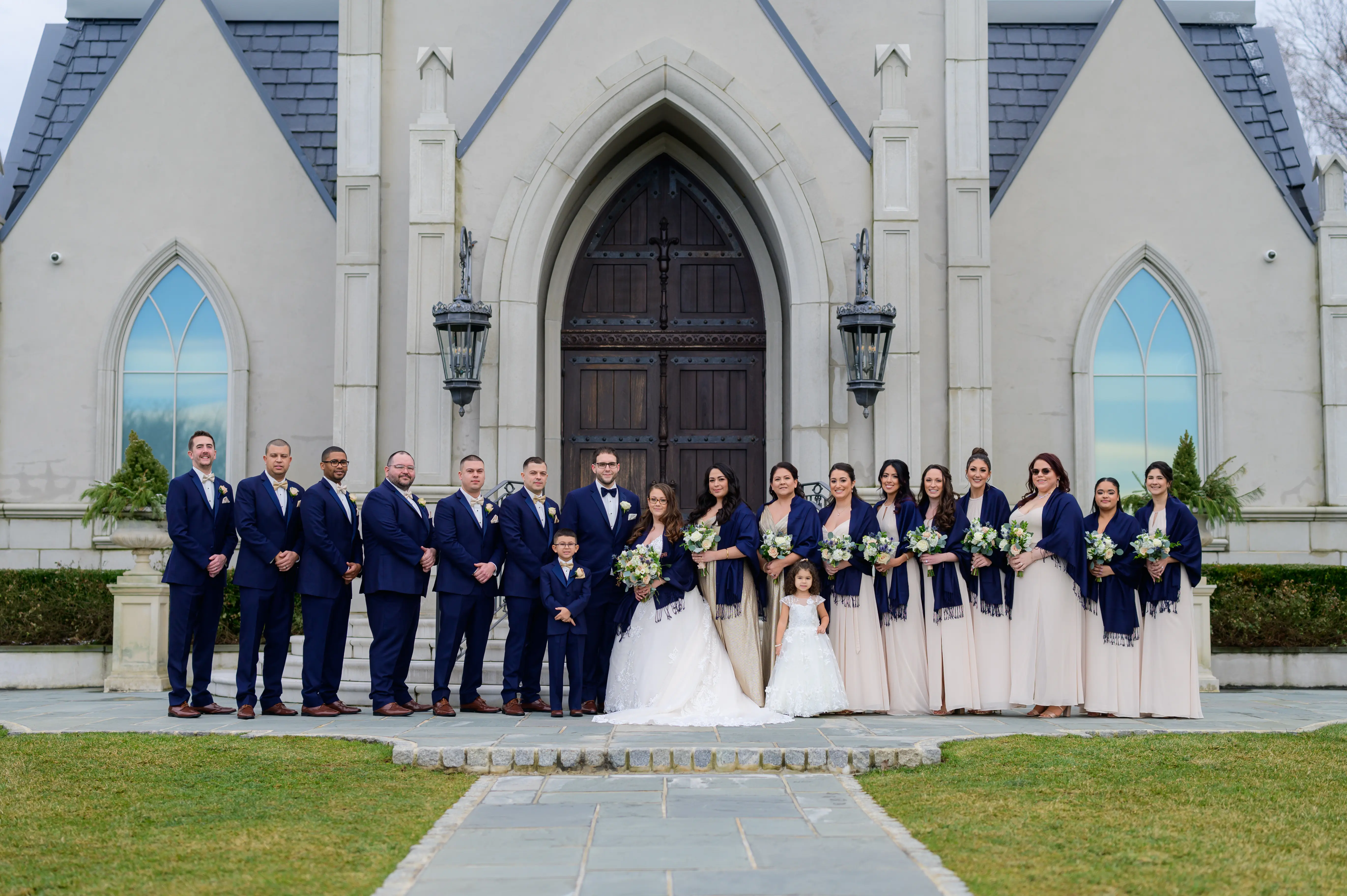 Bride in V neck ballgown called Trinity Lynette by Maggie Sottero with wedding party