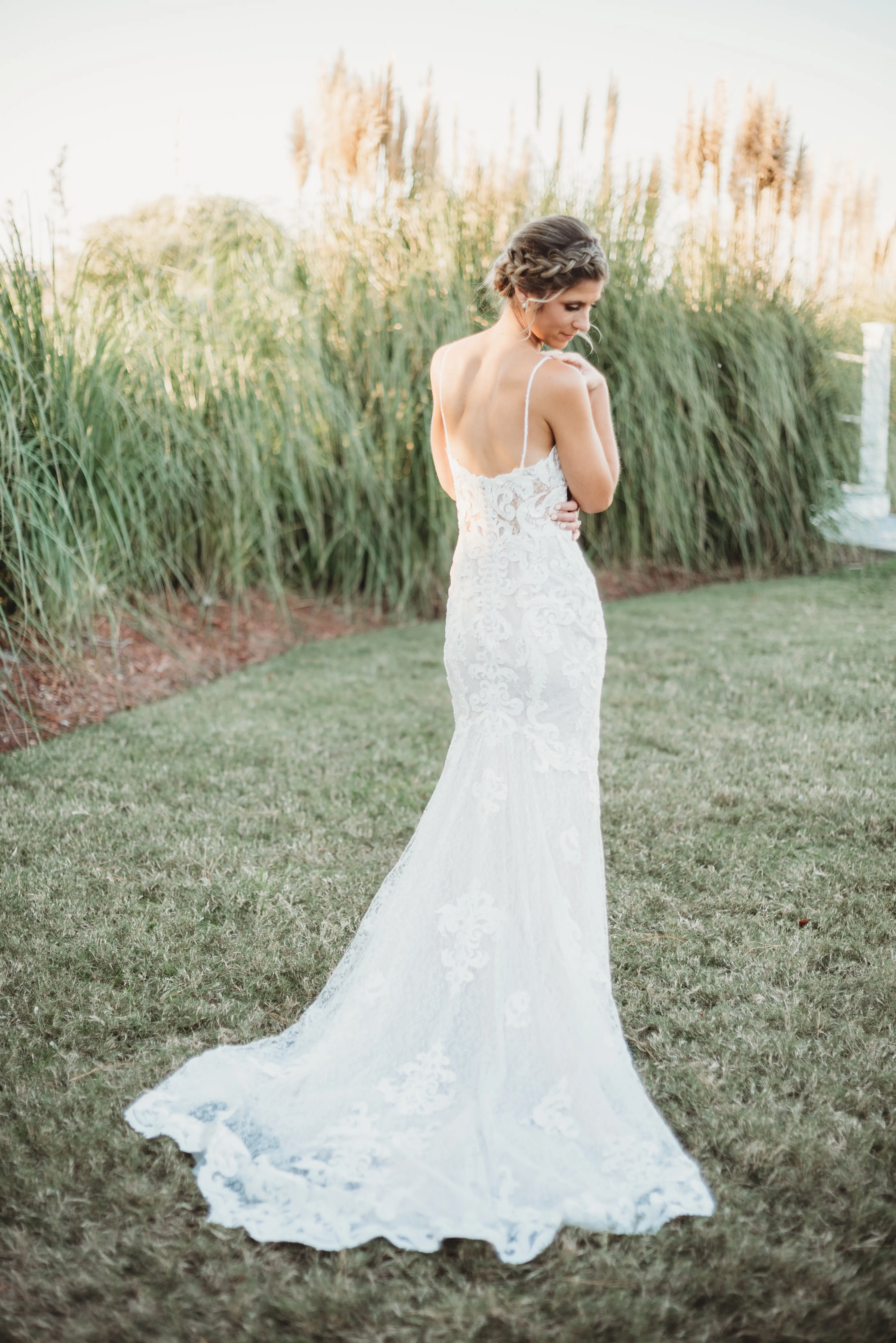 Bride in Mermaid Wedding Dress with Shimmering Lace Motifs and Illusion Plunging Sweetheart Neckline Called Tuscany by Maggie Sottero