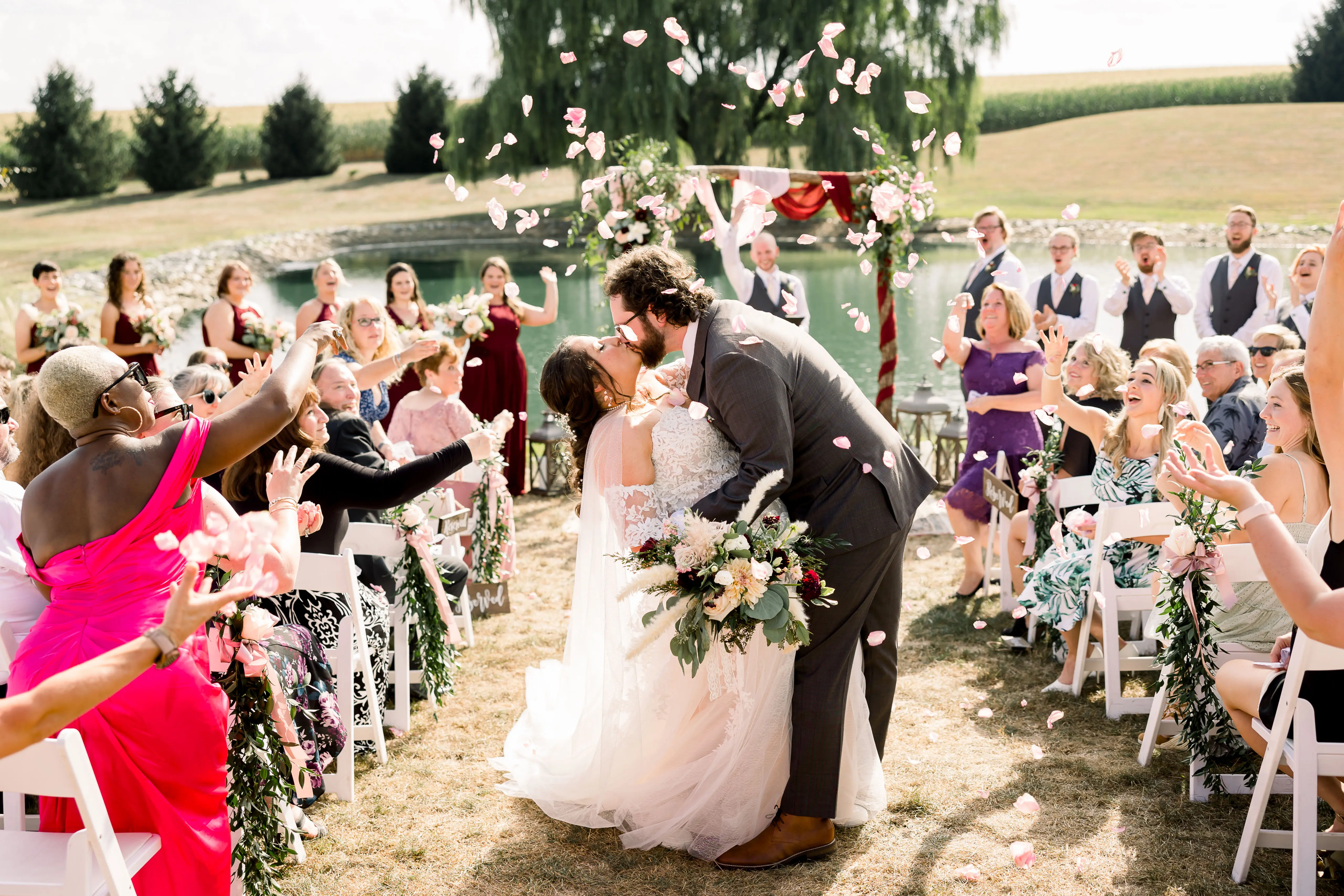 Plus Size Bride In Lace A-Line Wedding Dress Called Nora By Maggie Sottero With Groom At Ceremony