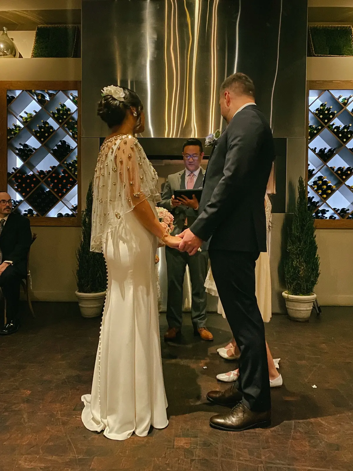Groom and Bride Wearing Minimalist Crepe Fit-and-Flare Wedding Dress Called Fernanda by Maggie Sottero