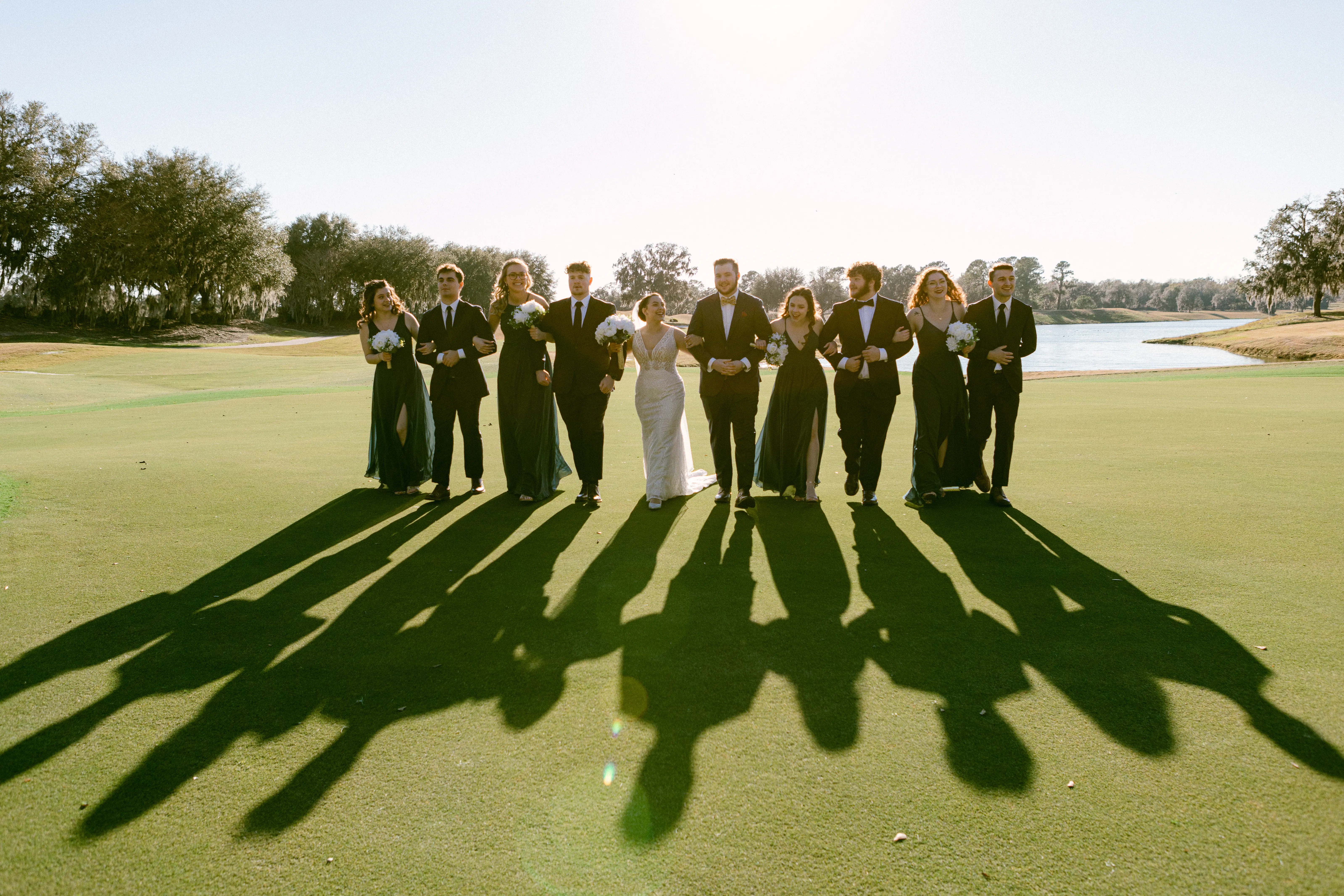Wedding Party with Bride in Gorgeous Art Deco Wedding Dress with Plunging Illusion V-Neckline Called Elaine by Maggie Sottero