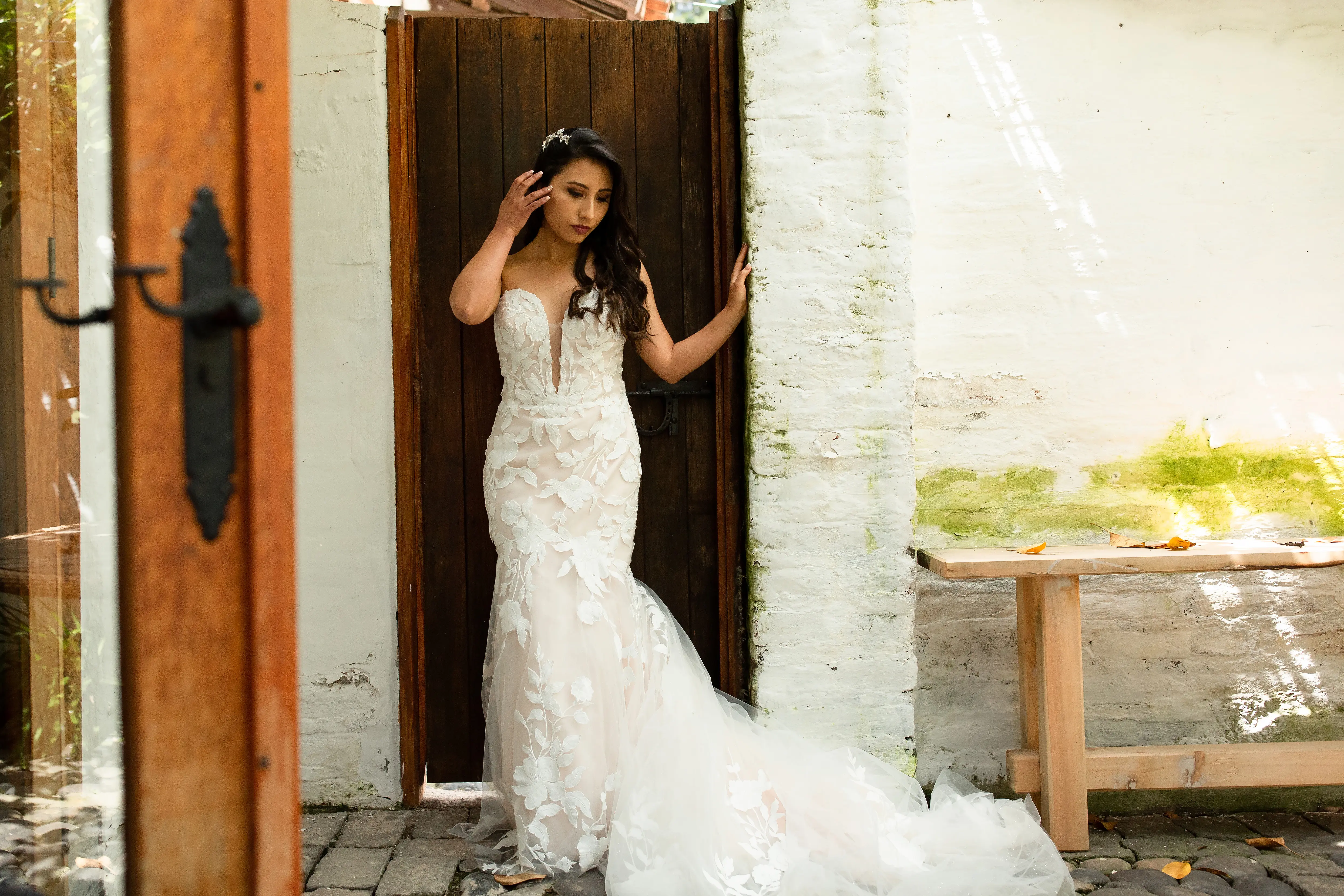 Bride wearing affordable, strapless mermaid wedding dress.
